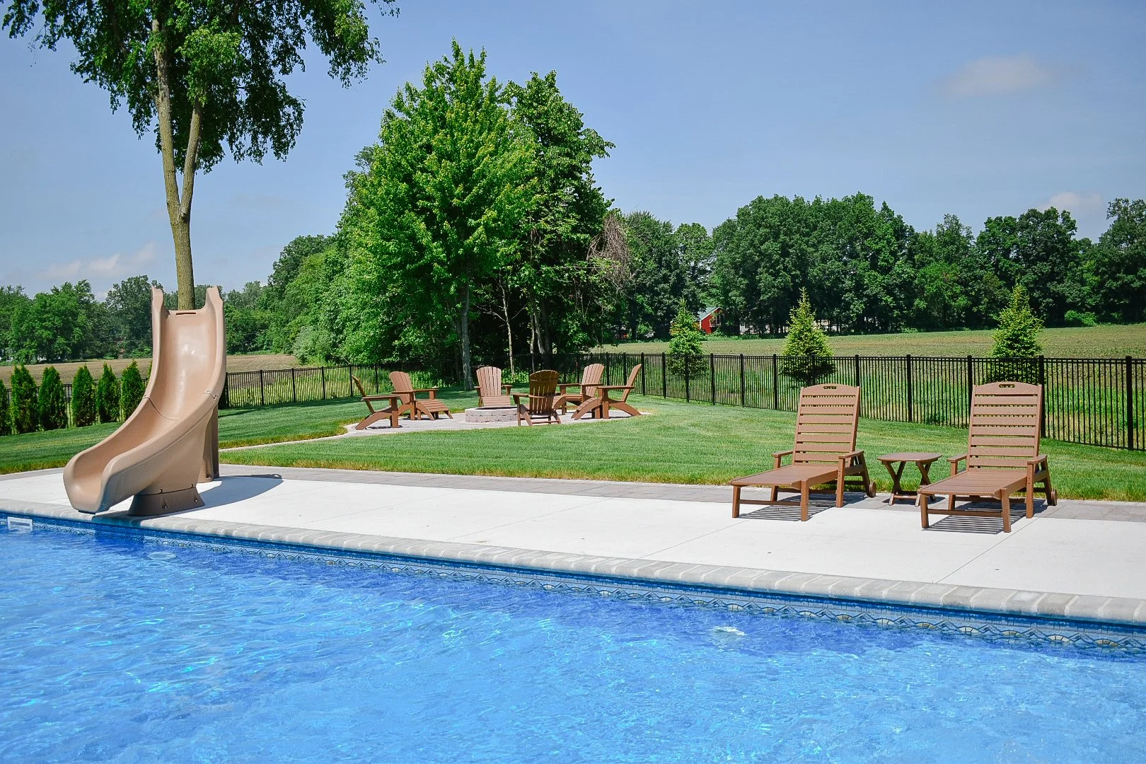 Integrated spa installation seamlessly incorporated into a custom backyard entertainment space with premium hardscape features — GLC Lawn & Landscape