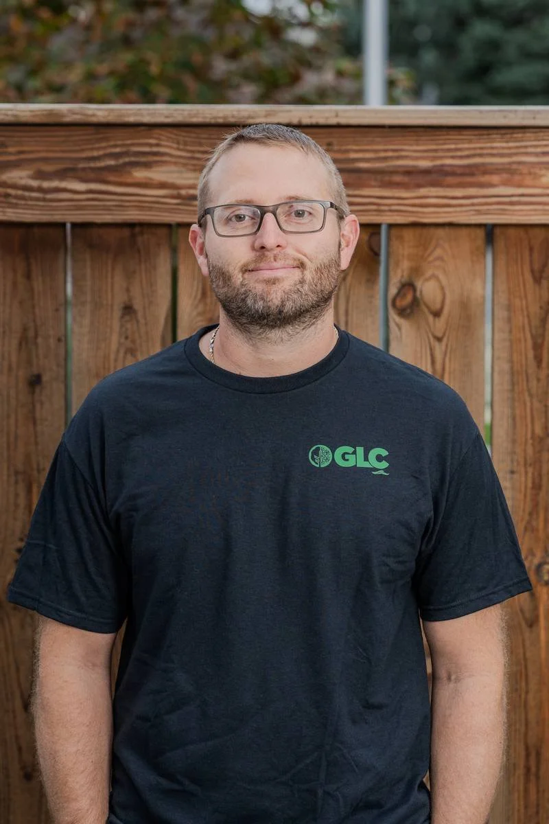 Frank, Fleet & Equipment Mechanic Apprentice, in a black GLC T-shirt — GLC Landscaping & Pools