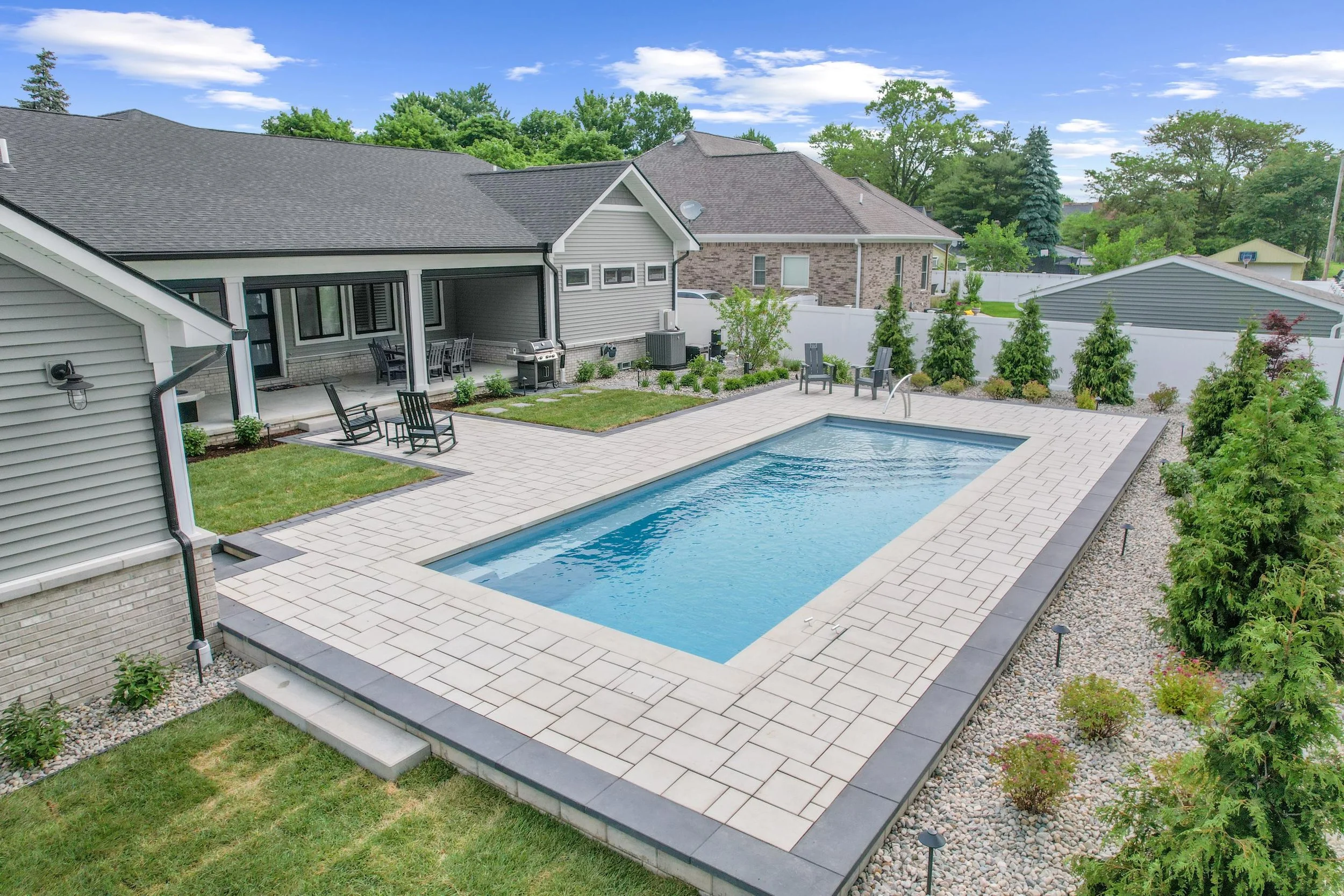 Beautiful paver patio with fiberglass pool design GLC Lawn