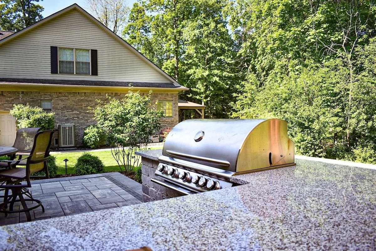 Outdoor kitchen installation with built-in grill and patio design in Flat Rock, MI