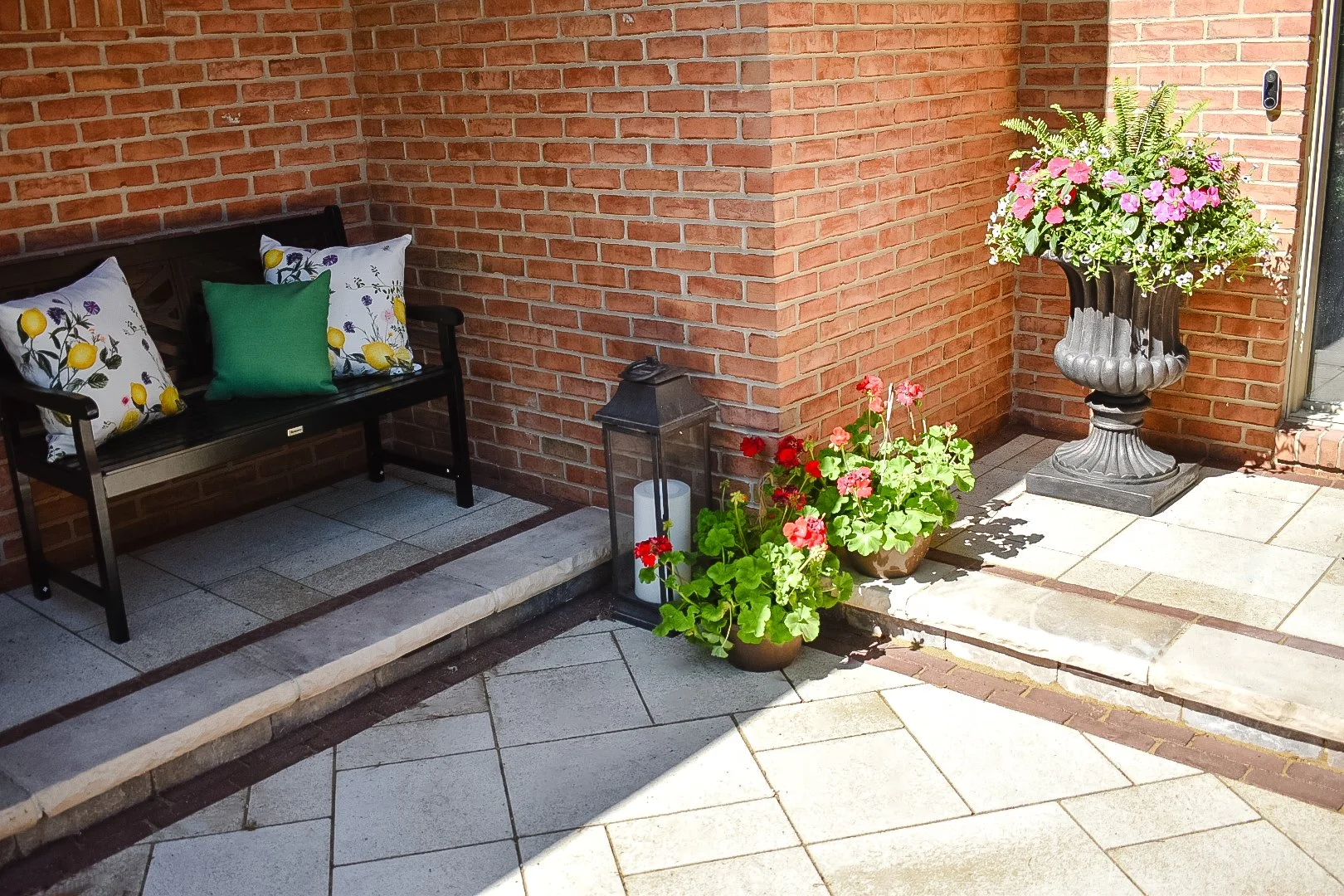 Front yard paver patio and walkway with mature landscape integration