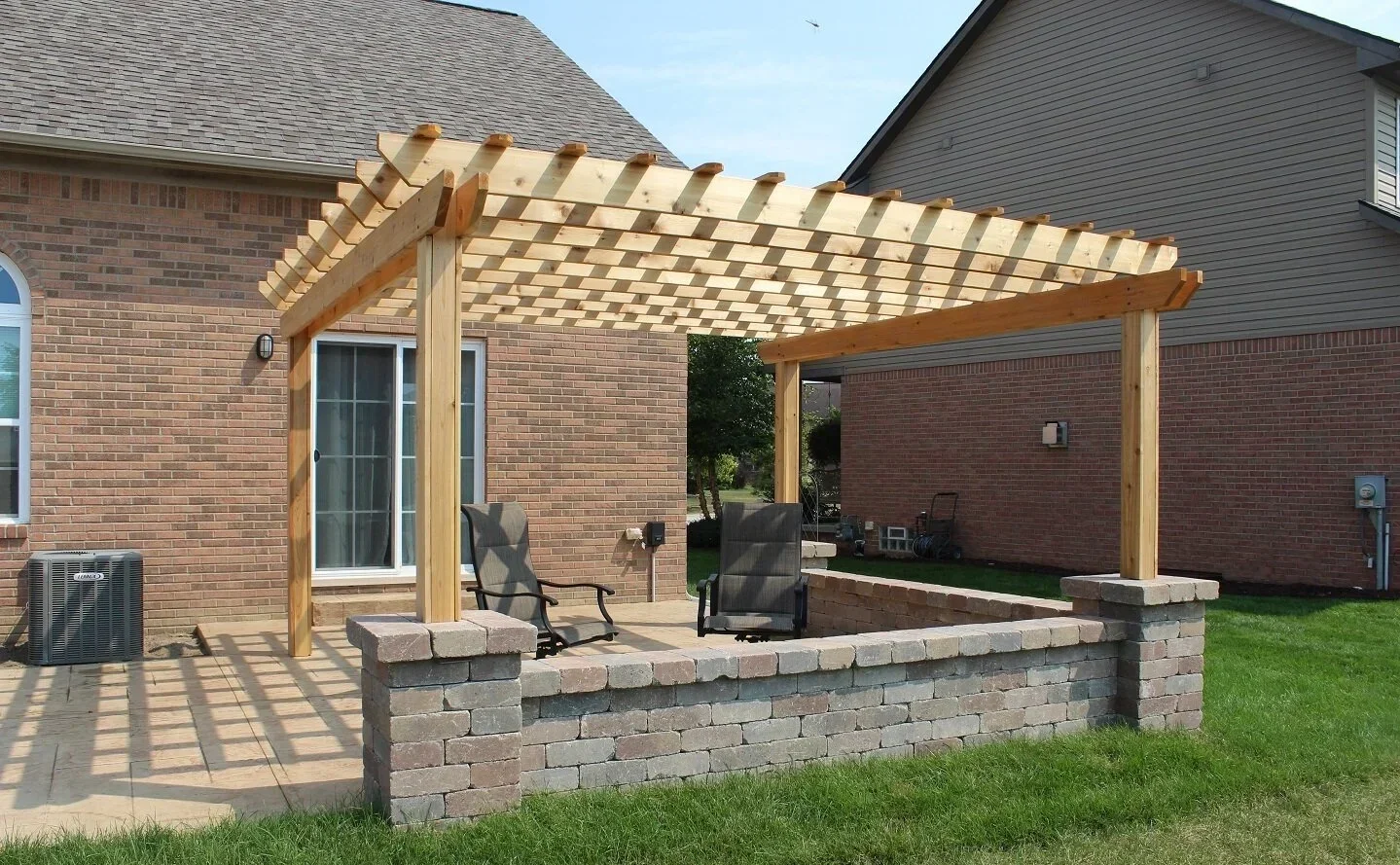 Pavilion with solid roof covering outdoor seating — GLC Lawn & Landscape