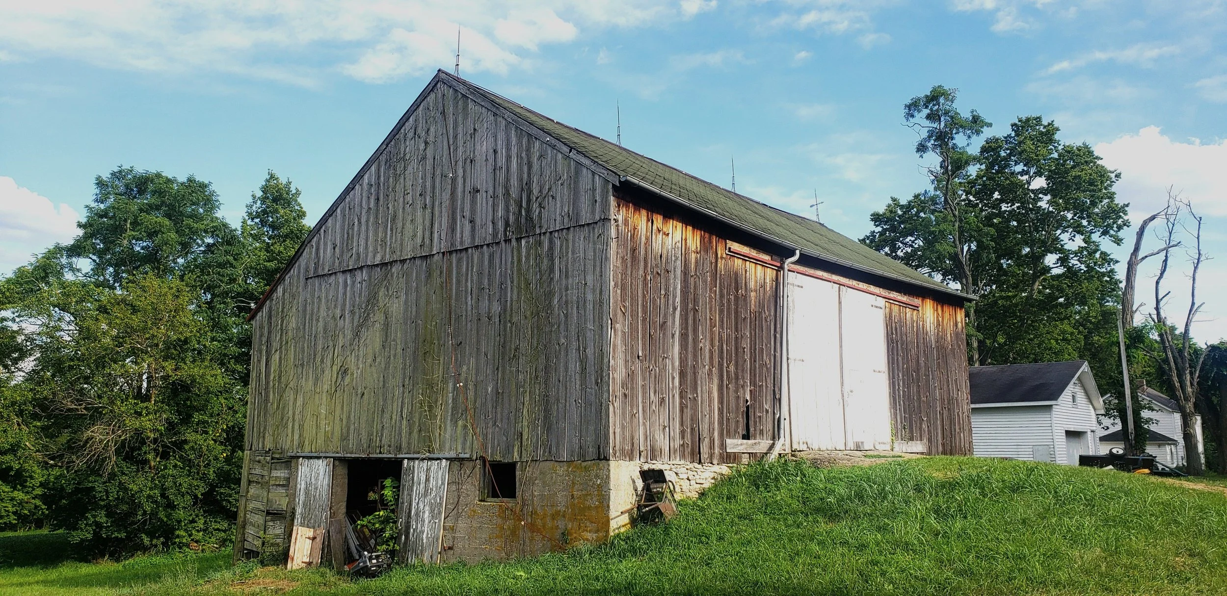 Old barn with some mold growing on it slowly falling down