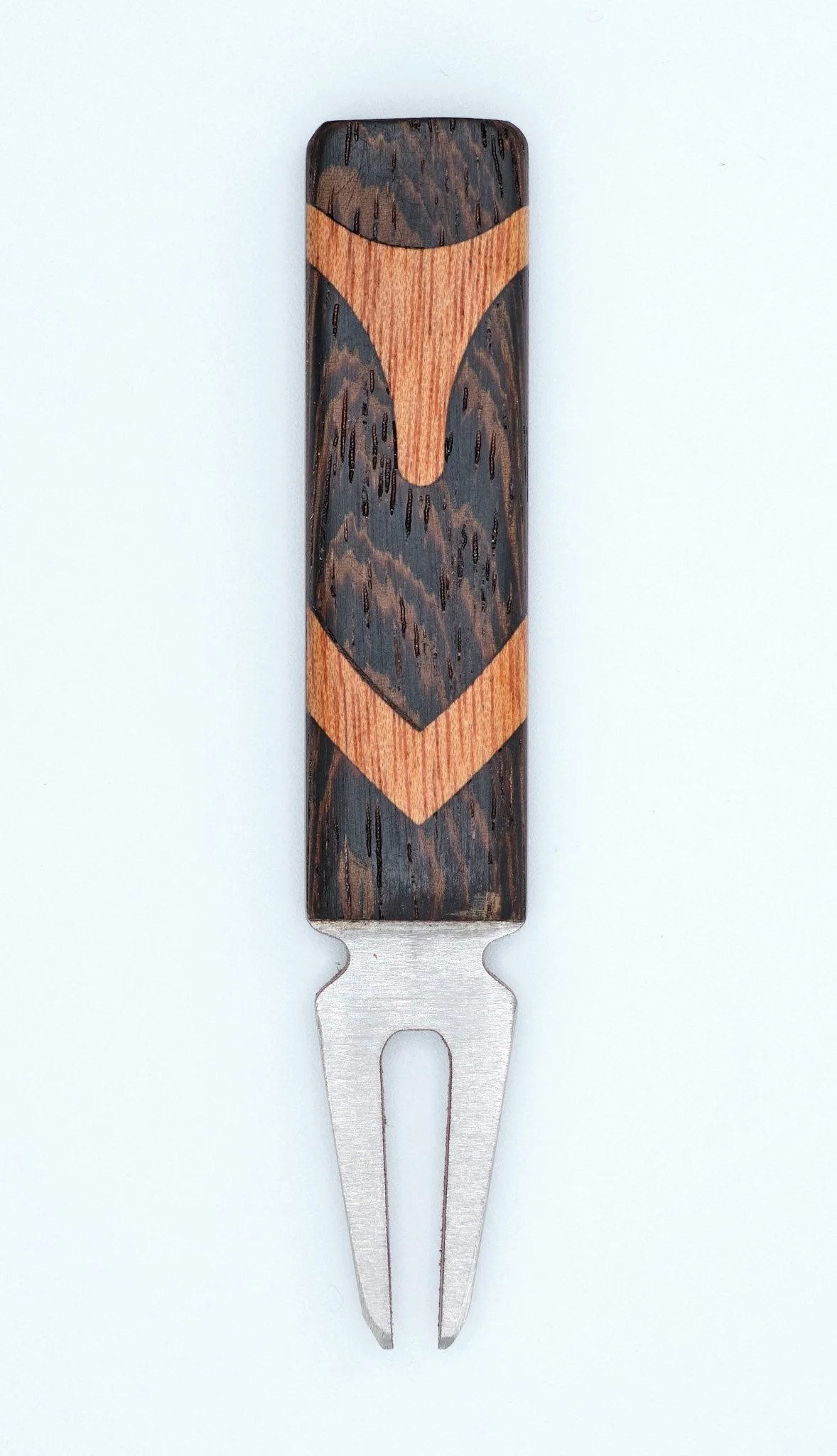 A fork with a wooden handle featuring a decorative design in black and orange.
