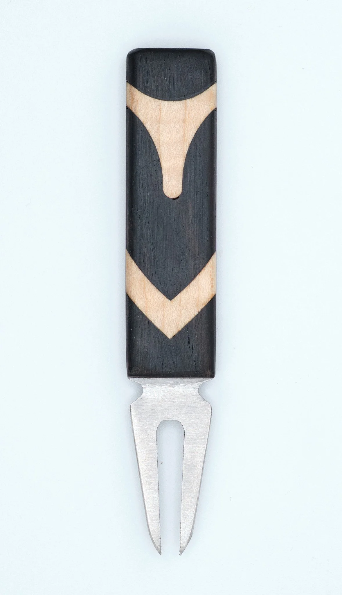 A small fork with a black and natural wood handle.