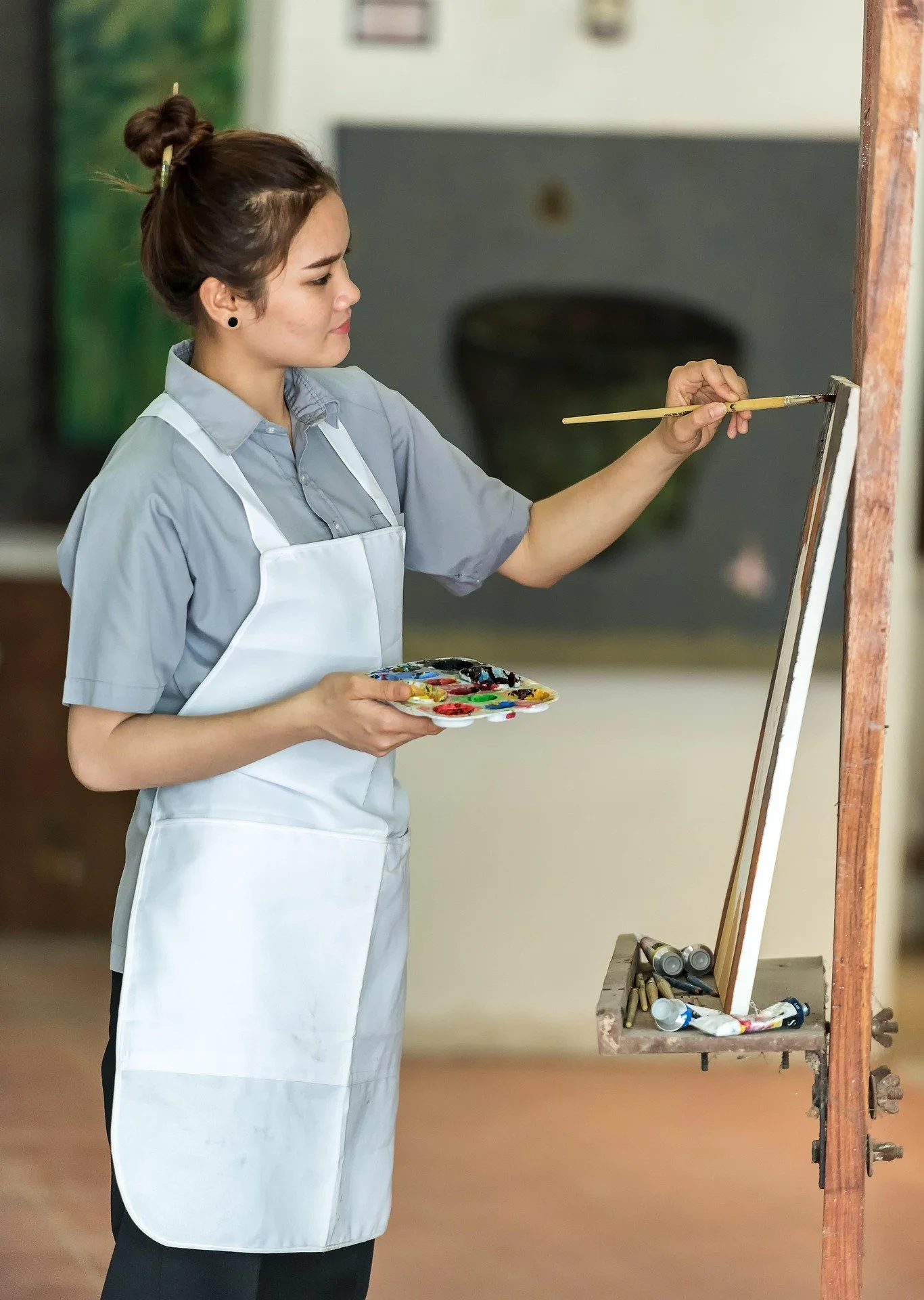 Artist painting on canvas