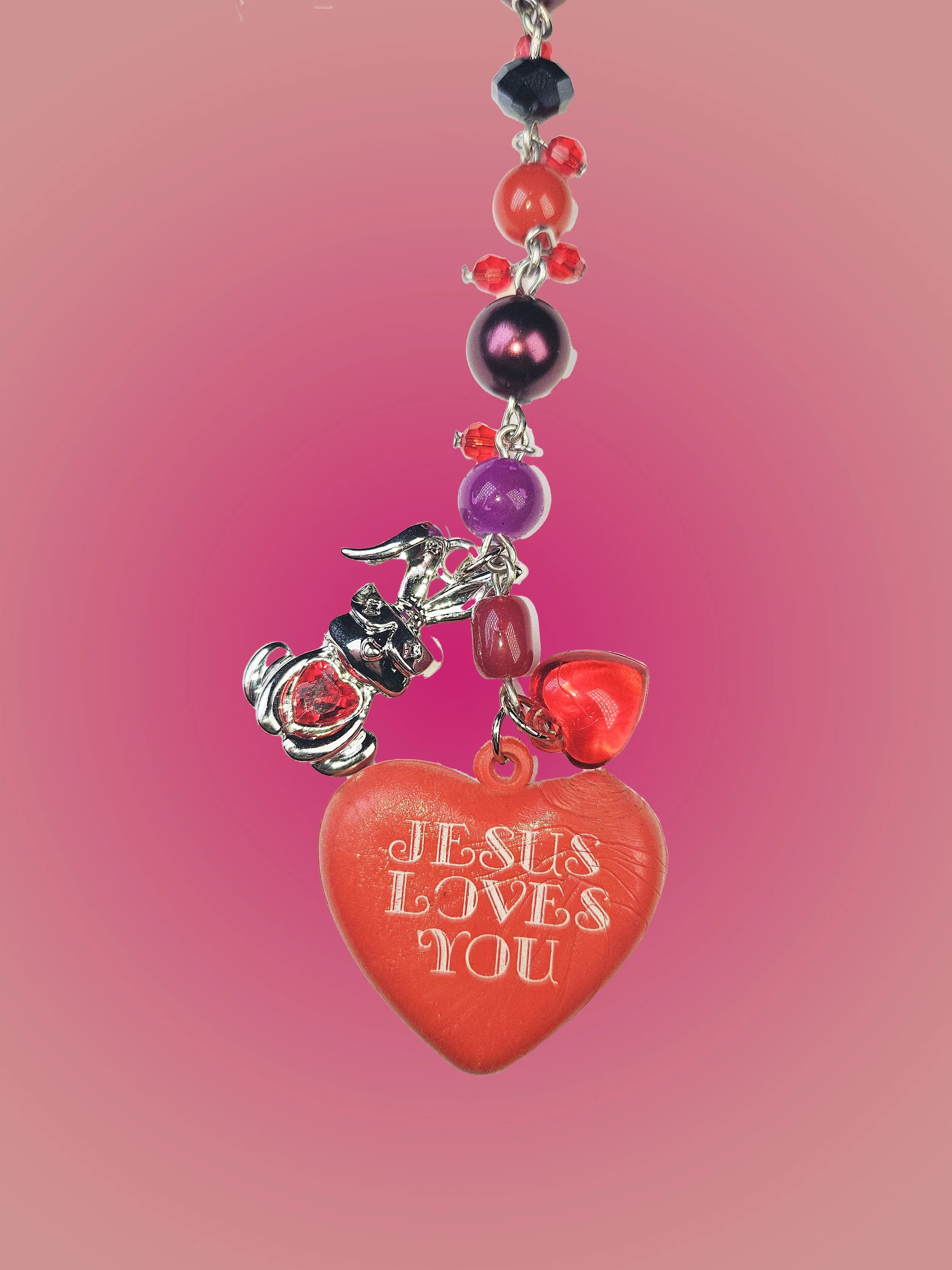 jesus loves u necklace closeup.jpg
