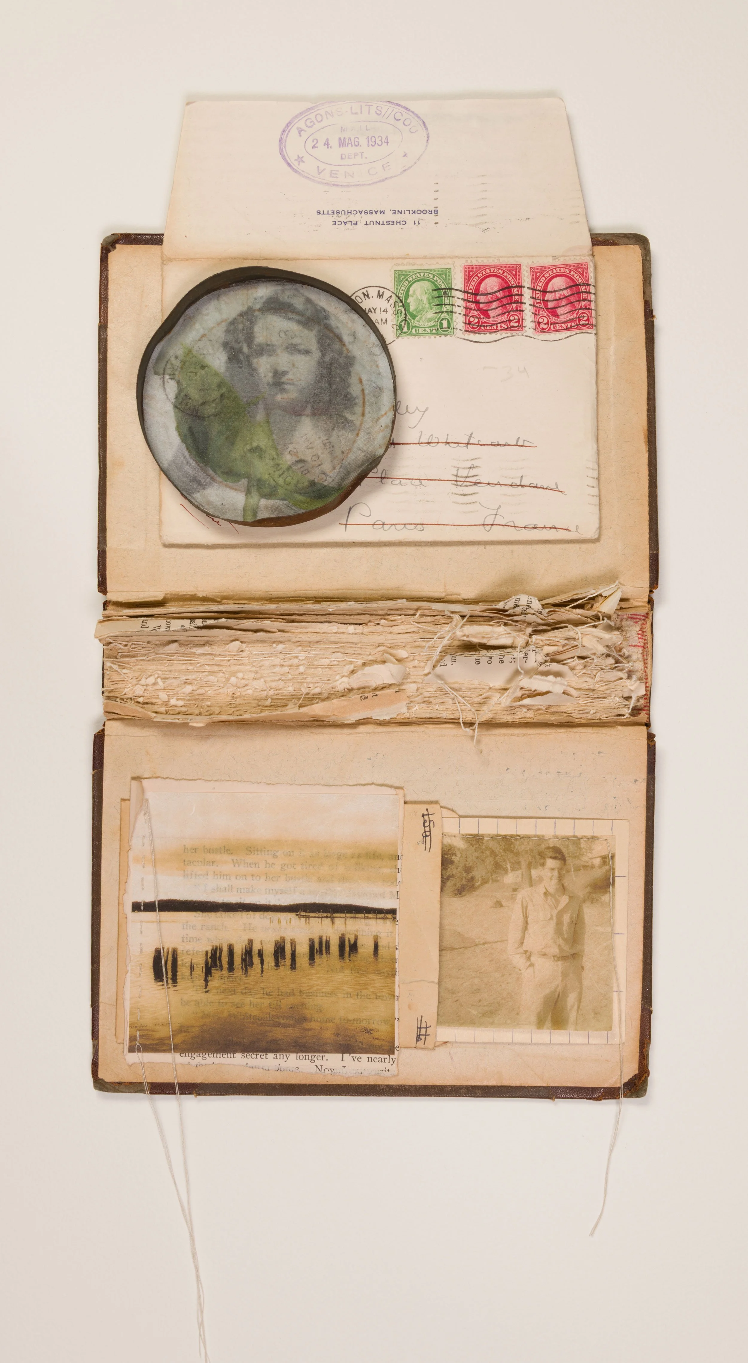 'Yearning' - repurposed book, vintage: envelope & stamps, tin cover, family photographs, silk organza, hemp paper, 
cotton thread  13.75 x 7.5 inches 