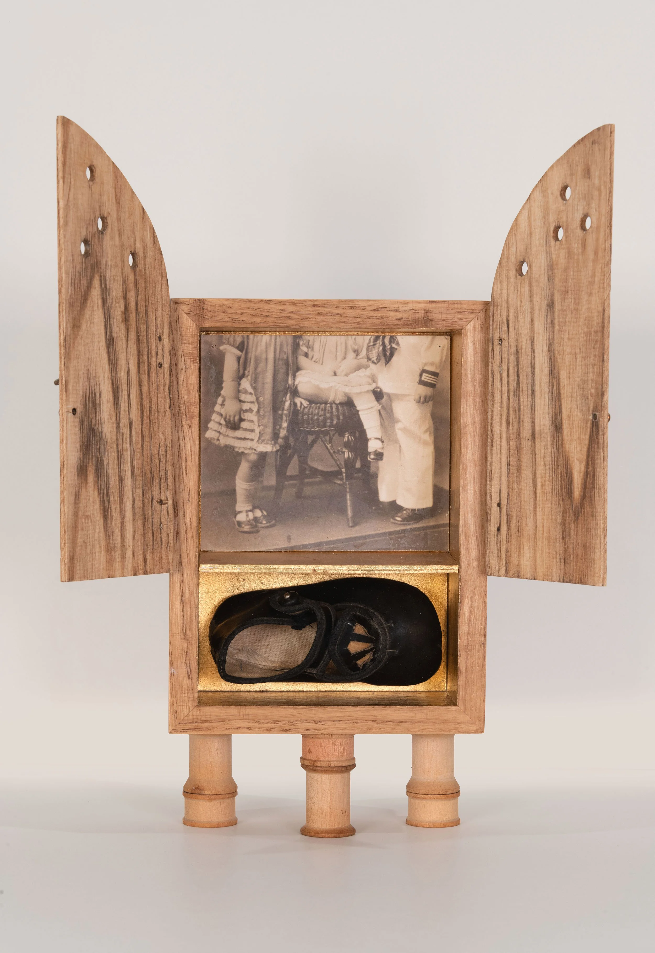 Reliquary (front)  - handmade ash wood box, gold leaf, vintage family photographs, vintage child's shoe, thread spools, distressed brass hardware  12.25 x 8.25 x 5.5 inches

