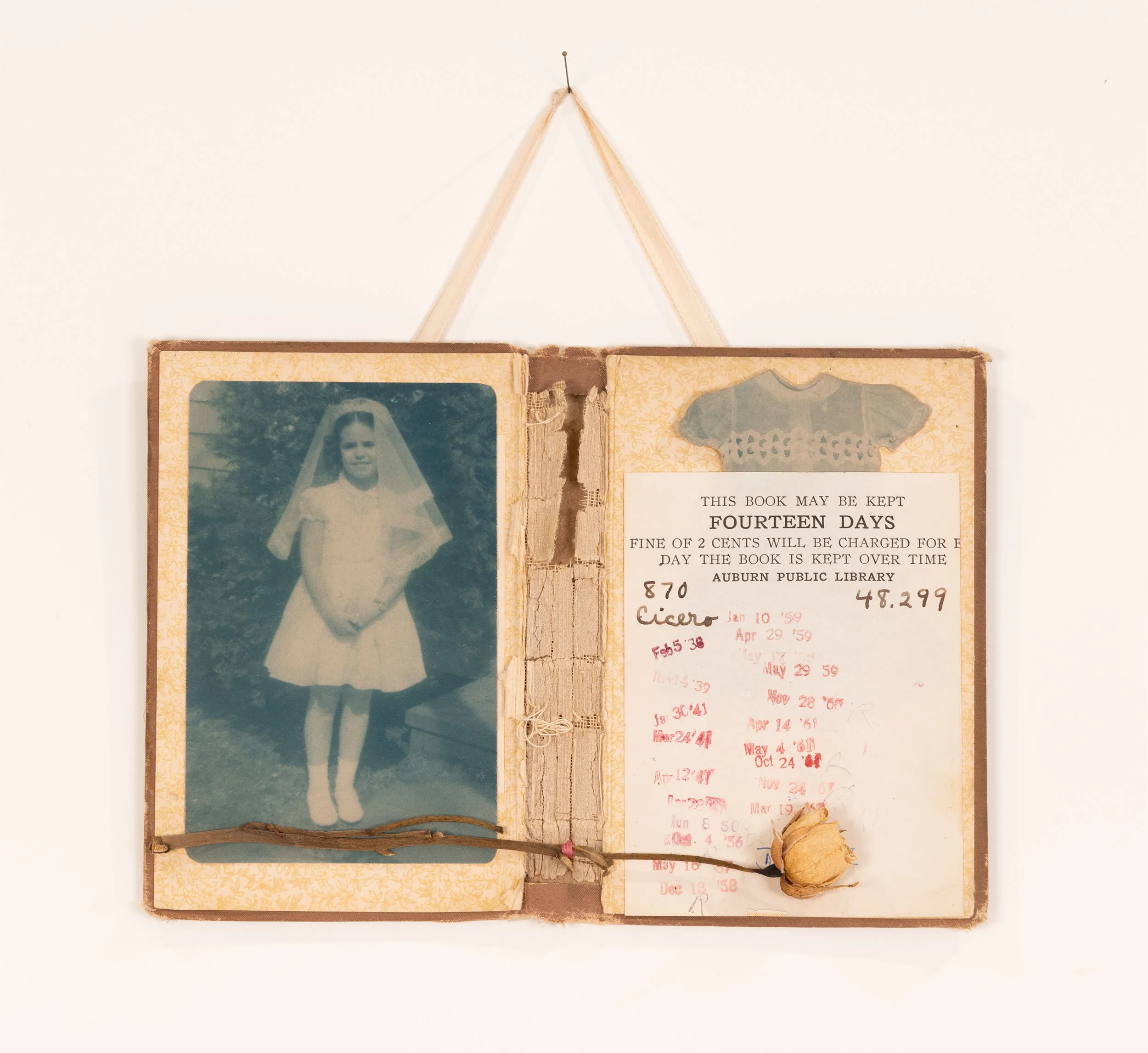 Hand Me Down Dress, Borrowed Innocence - deconstructed book, cyanotype vintage family photograph, cyanotype paper dress, dried rose, satin ribbon, thread  6 x 8.5 inches