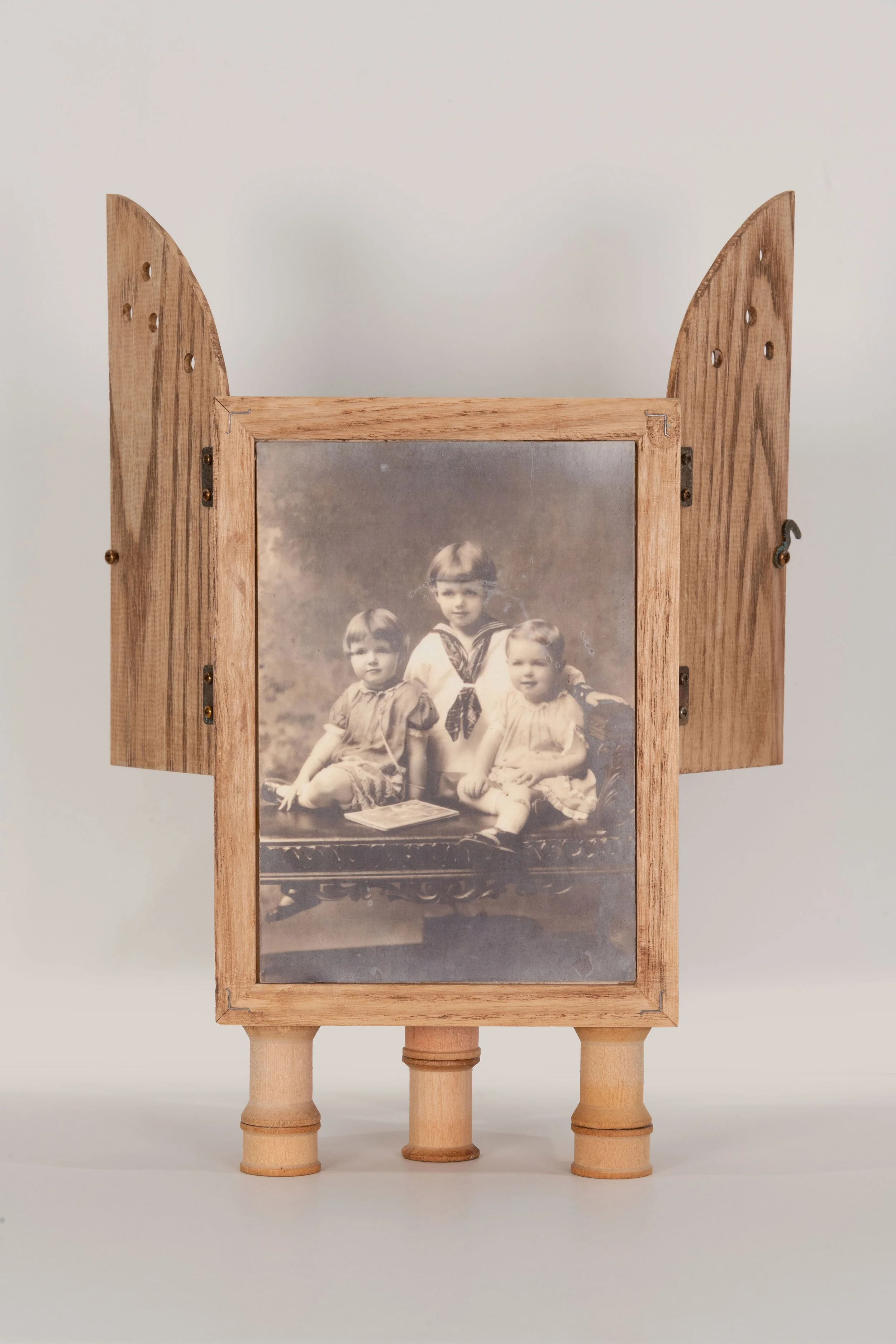 Reliquary (back) - handmade ash wood box, gold leaf, vintage family photographs, vintage child's shoe, thread spools, distressed brass hardware   12.25 x 8.25 x 5.5 inches