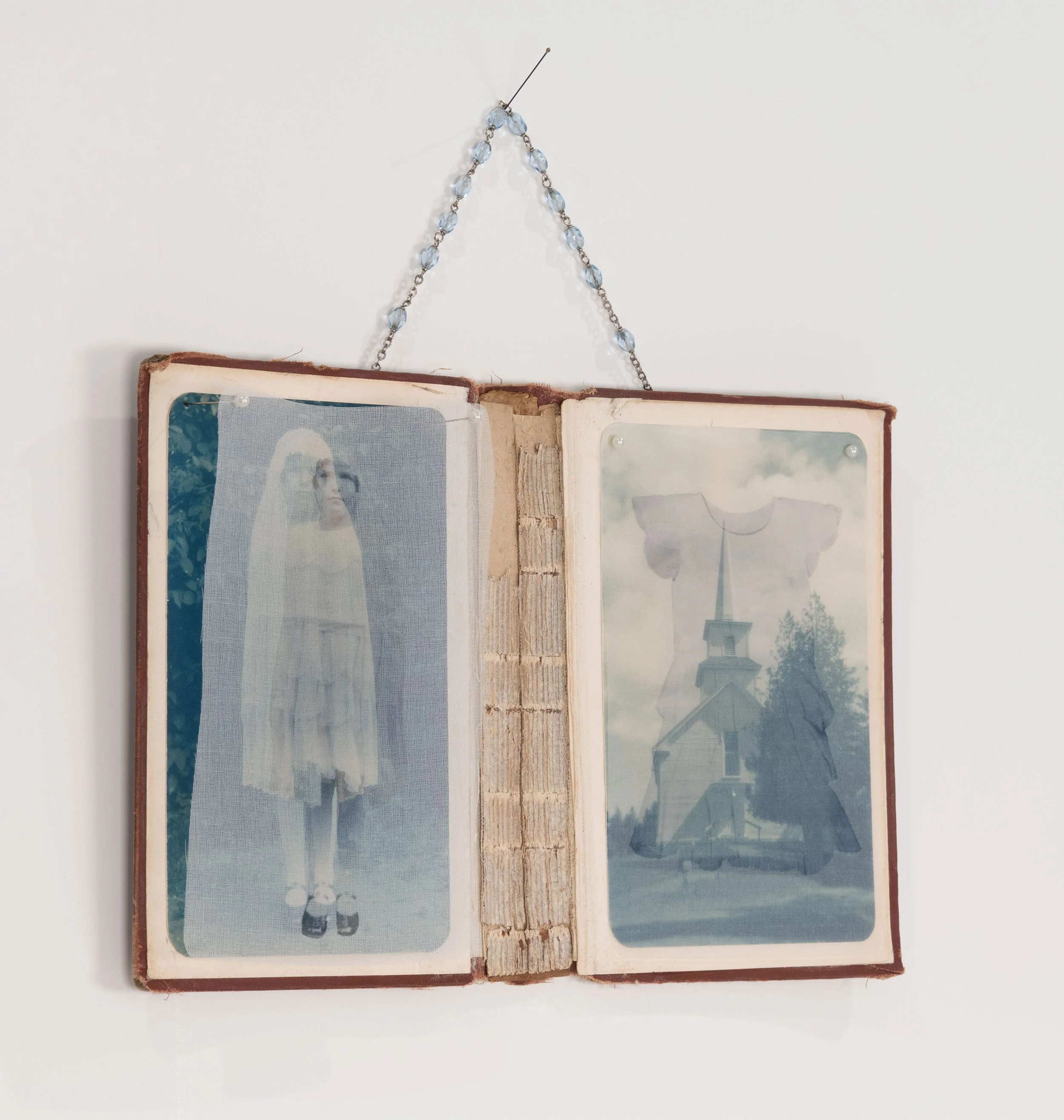 You Can Have My Sheath But Not My Soul - deconstructed book, toed cyanotype family photographs, silk organza, rosary chain, straight pins  7.5 x 11 inches