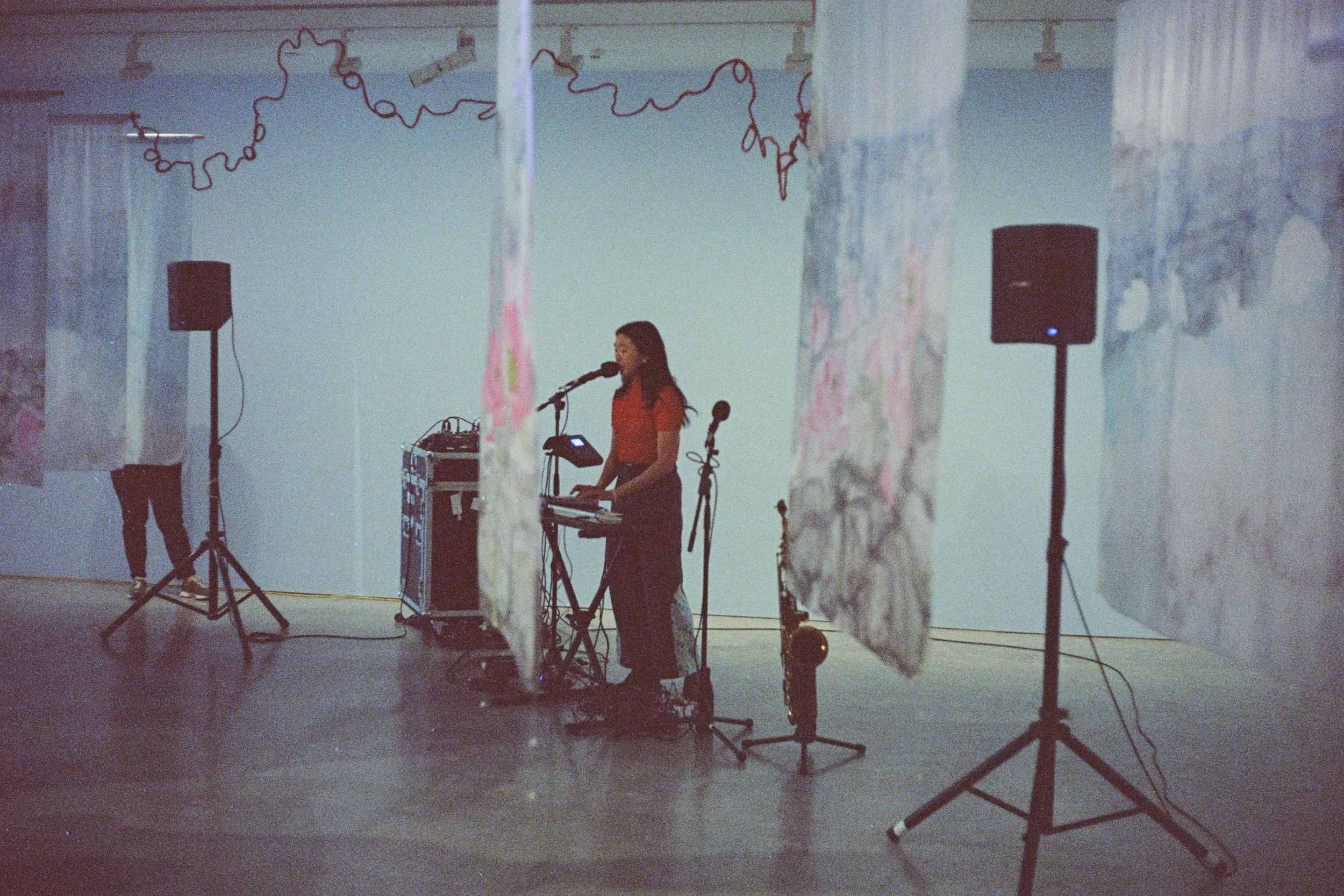 Rainbow Chan performing an ambient set within "Long Distance Call 長途電話" installation, 21 Sep 2024. Photo: Paul Pinga Matereke.