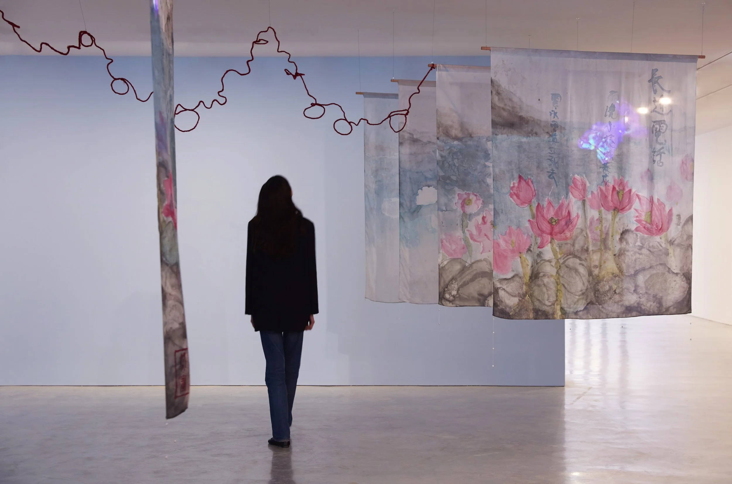 "Long Distance Call", 2024. Silk dye on habotai silk, wax resist, freshwater pearls, jute twine, linocut print, digital animation, audio track. Series of 8: each 180cm x 140cm, Museum of Contemporary Art Australia, Sydney. Animation by Rel Pham. Phot
