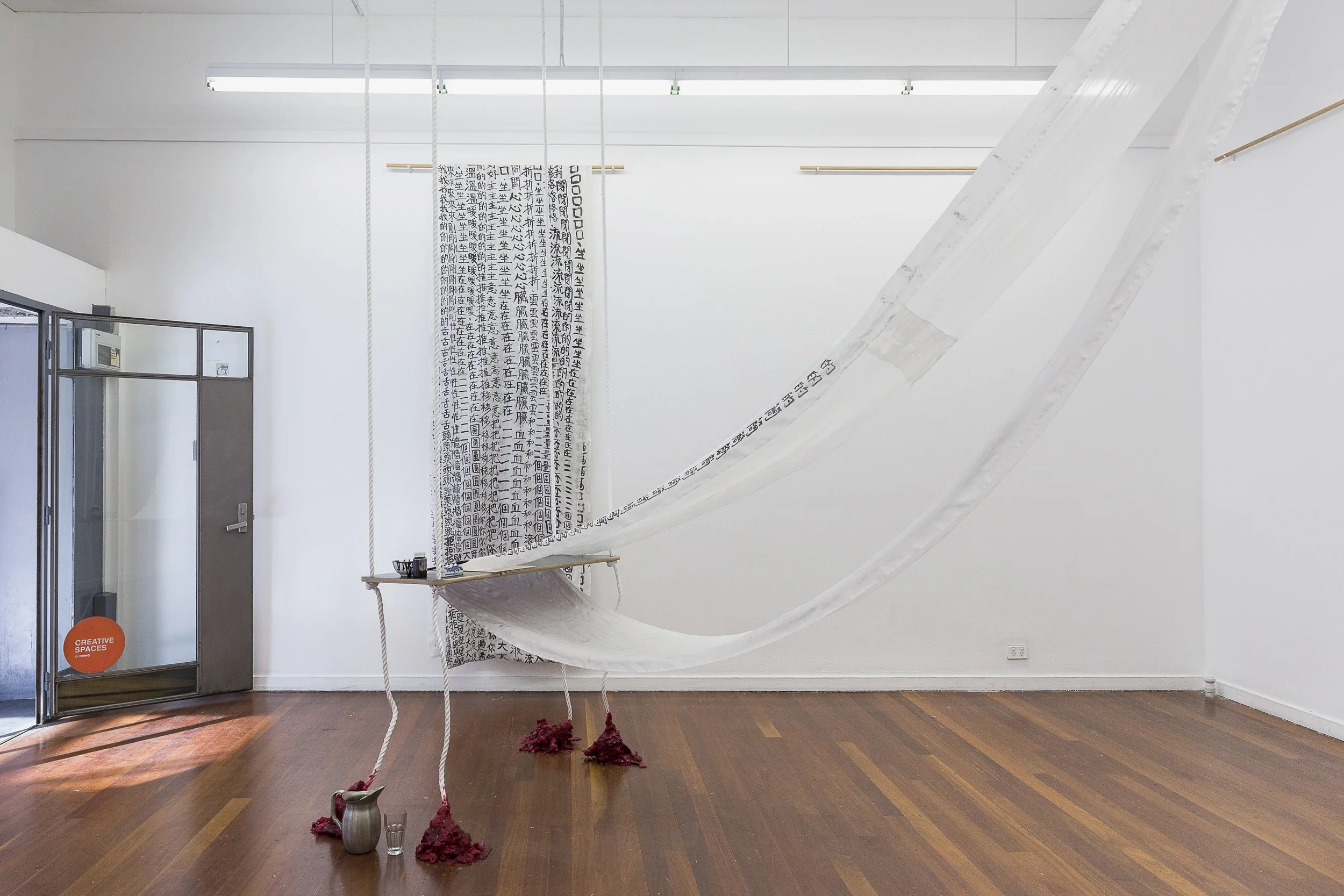 "To enclose one’s mouth", 2017, ink, silk, wood, video loop, dimensions variable (installation view). Photo: Document Photography.