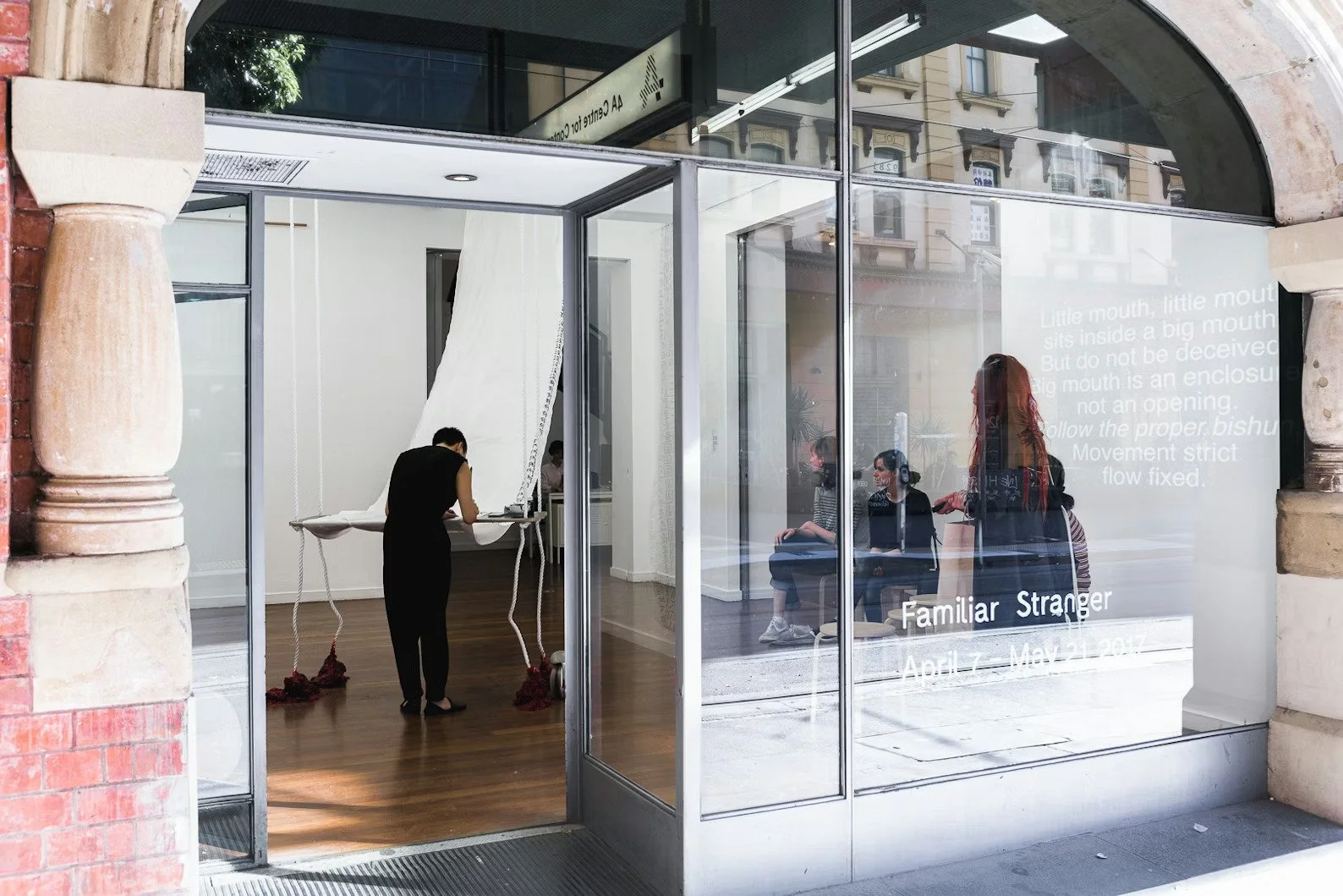 Rainbow Chan performing as part of "To enclose one’s mouth", 2017, ink, silk, wood, video loop, dimensions variable. Photo: Document Photography.