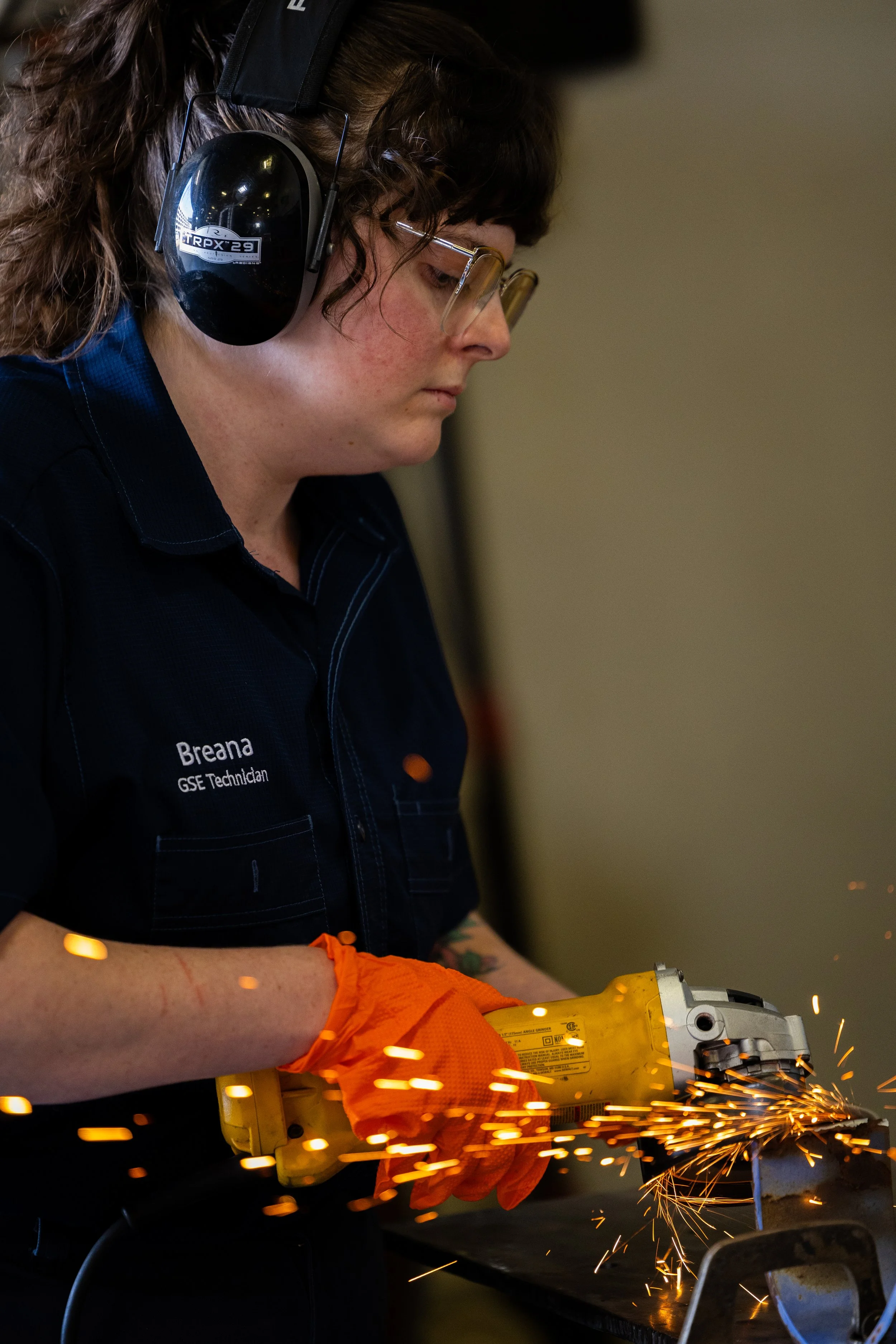 April 2025 - Southwest Airlines Ground Service Technician using an angle grinder.
