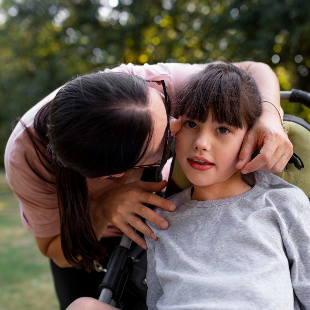 Compassionate caregiver connecting with a child through attentive, relationship-based care for families in Chester County and the Main Line.