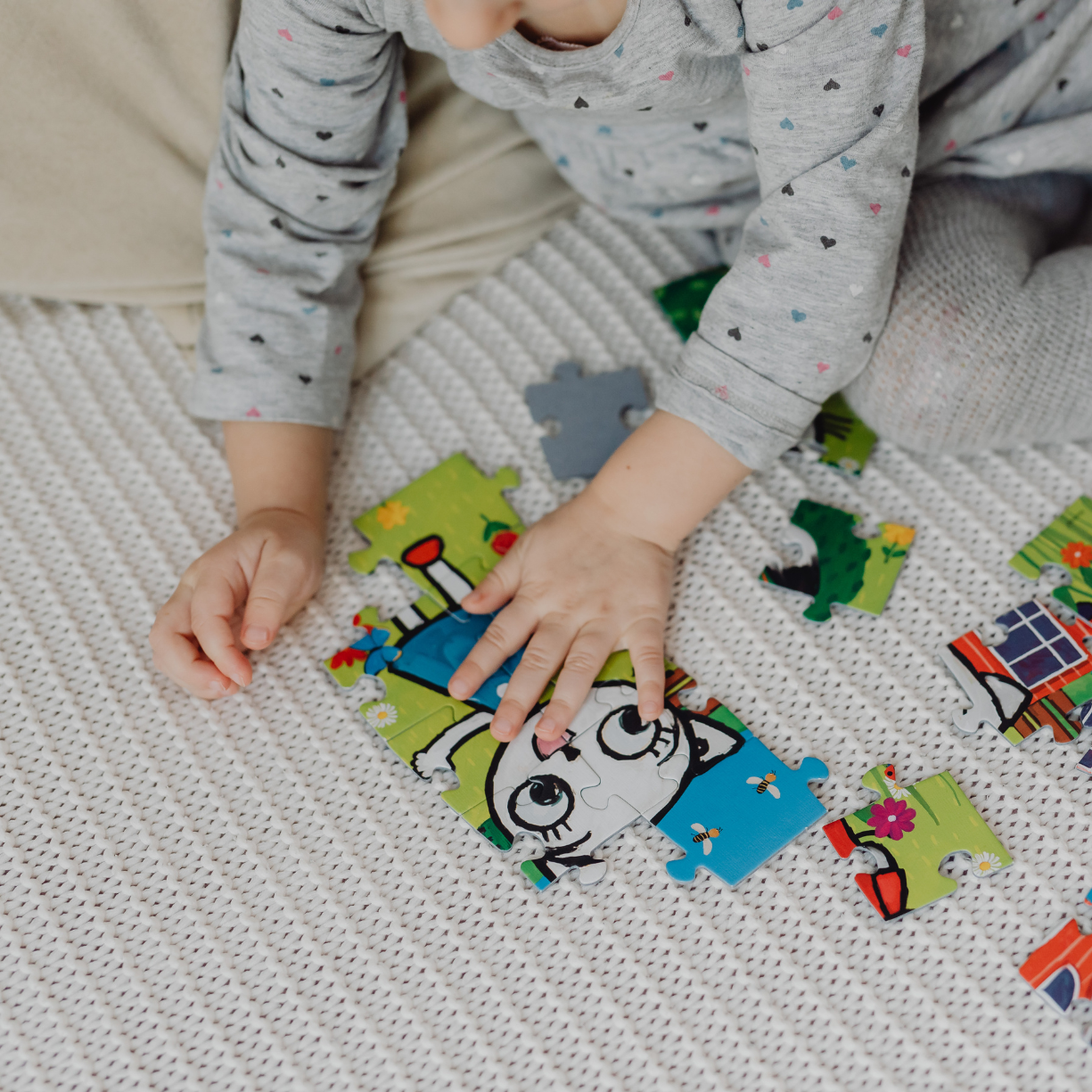Young child in Chester County, PA, developing fine motor and problem-solving skills through hands-on educational play and learning activities.