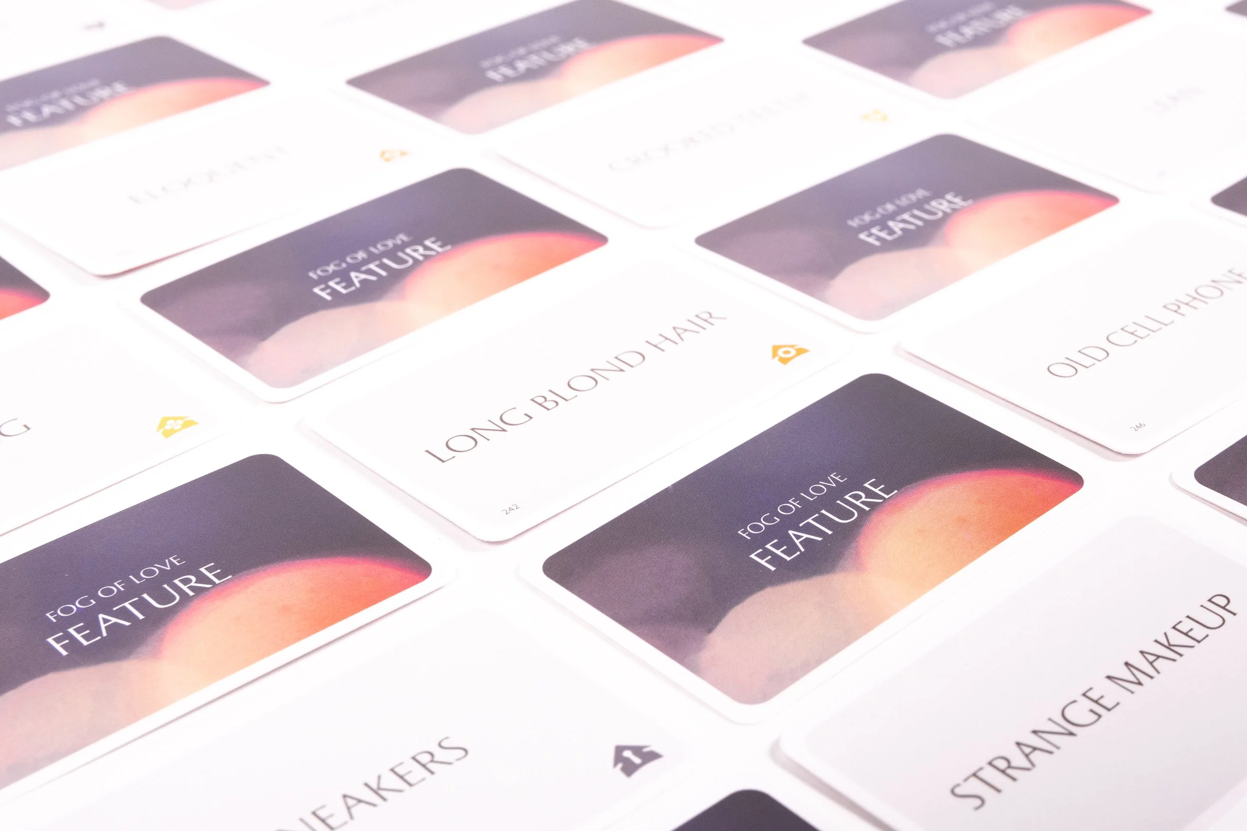 Collection of cards with various fashion-related descriptions, including one that says "Fog of Love Feature" and "Long Blonde Hair".