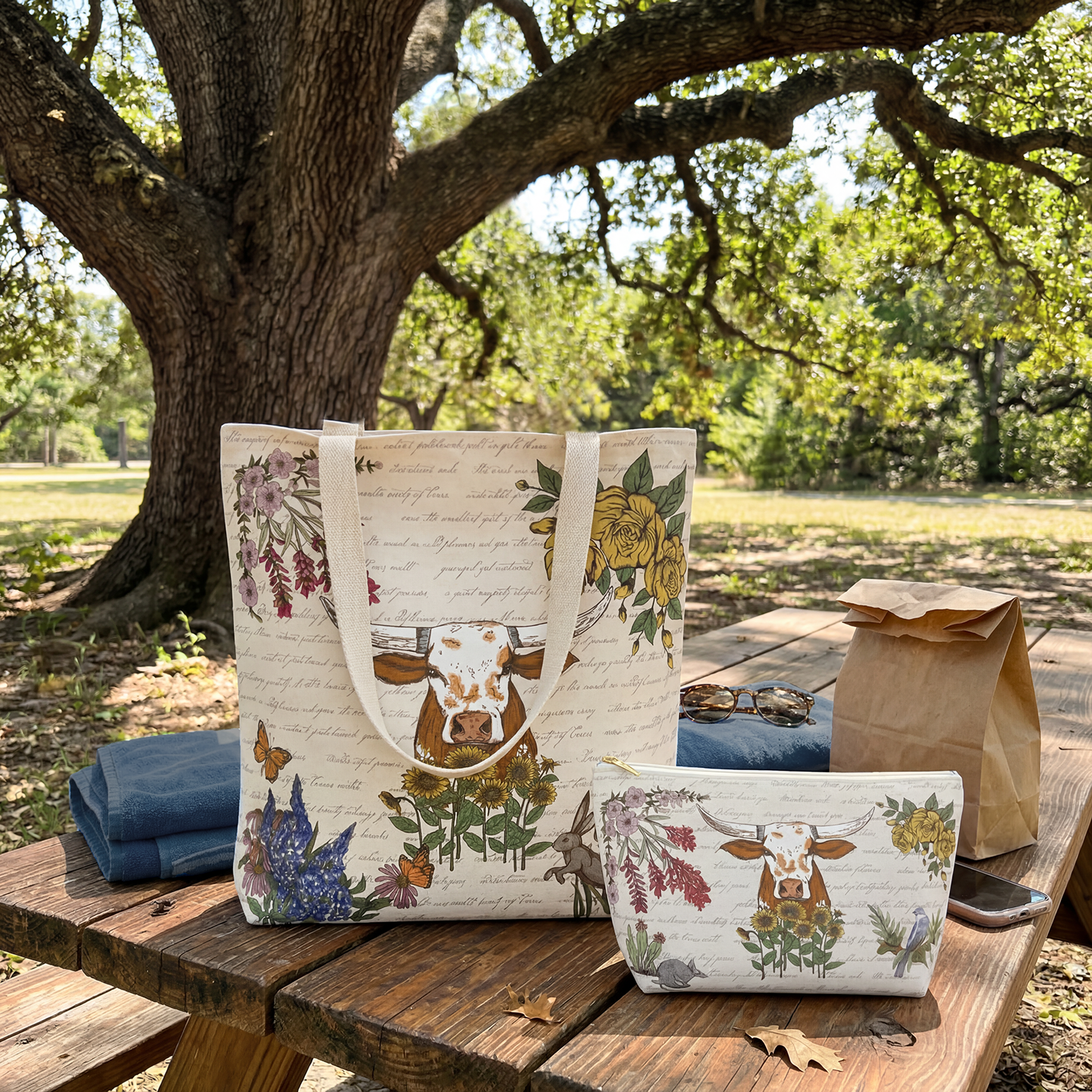 Texas Lone Star Wilds market tote and zipper pouch featuring hand-drawn Texas flora and longhorn illustration