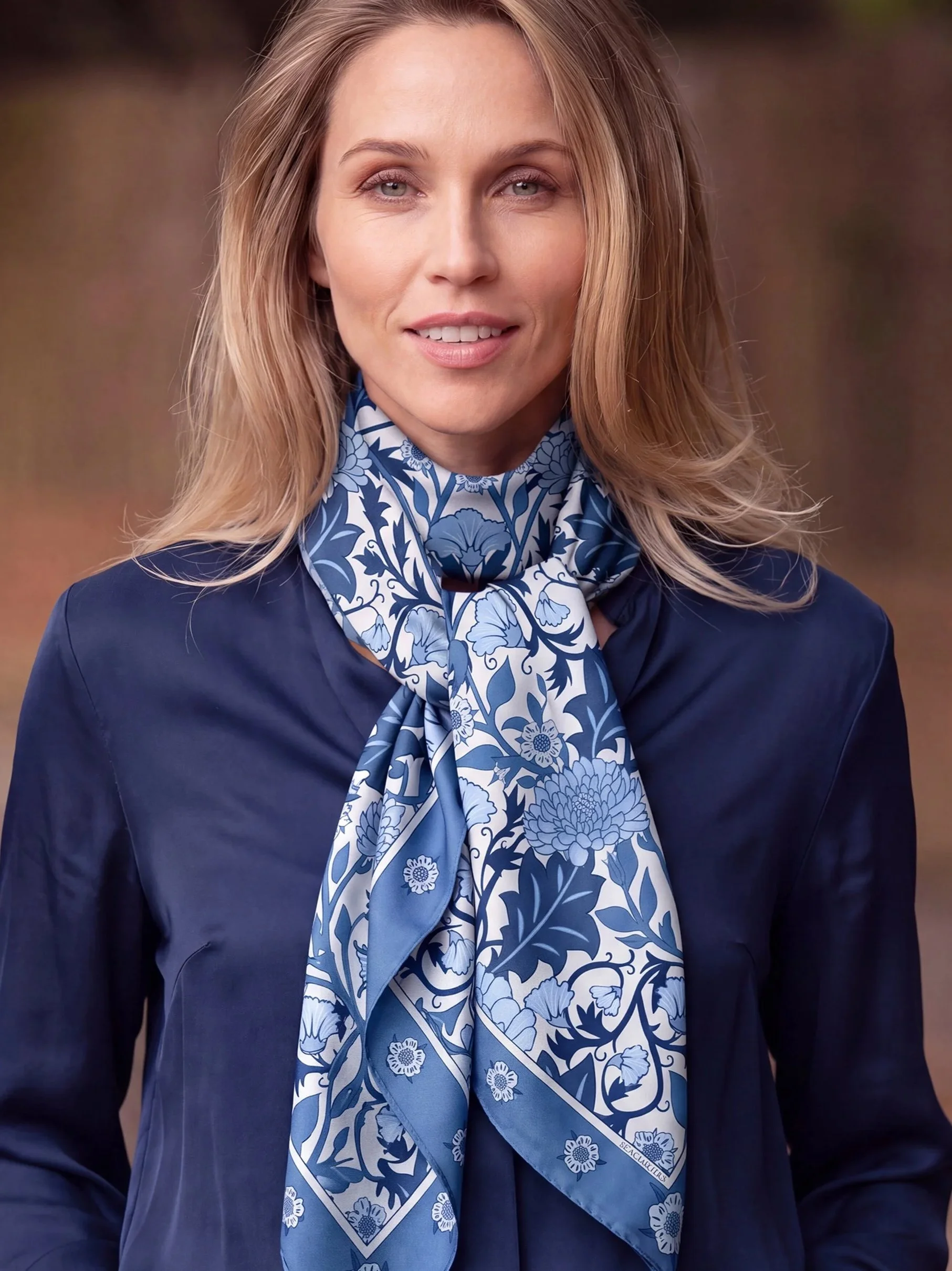 View Cobalt Garden press materials featuring a woman wearing the blue-and-white Cobalt Garden silk scarf.