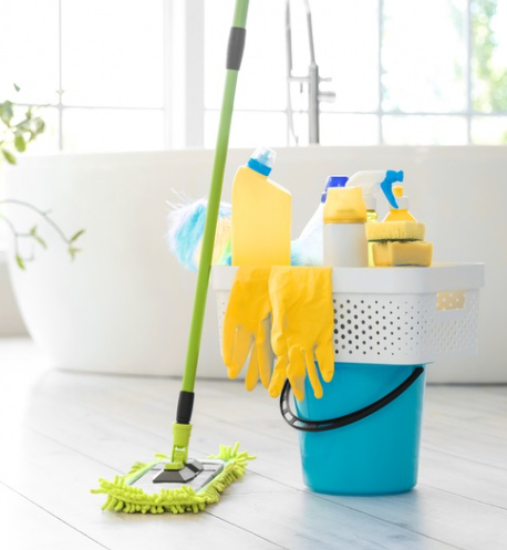Bucket filled with cleaning supplies and a mop for residential and commercial floor cleaning services.