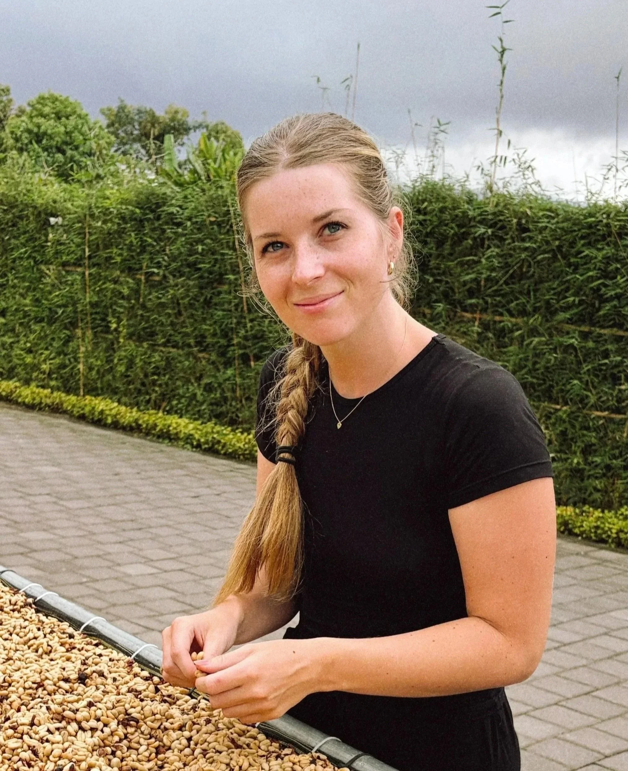 Co-founder Silke van Leest next to coffee drying bed