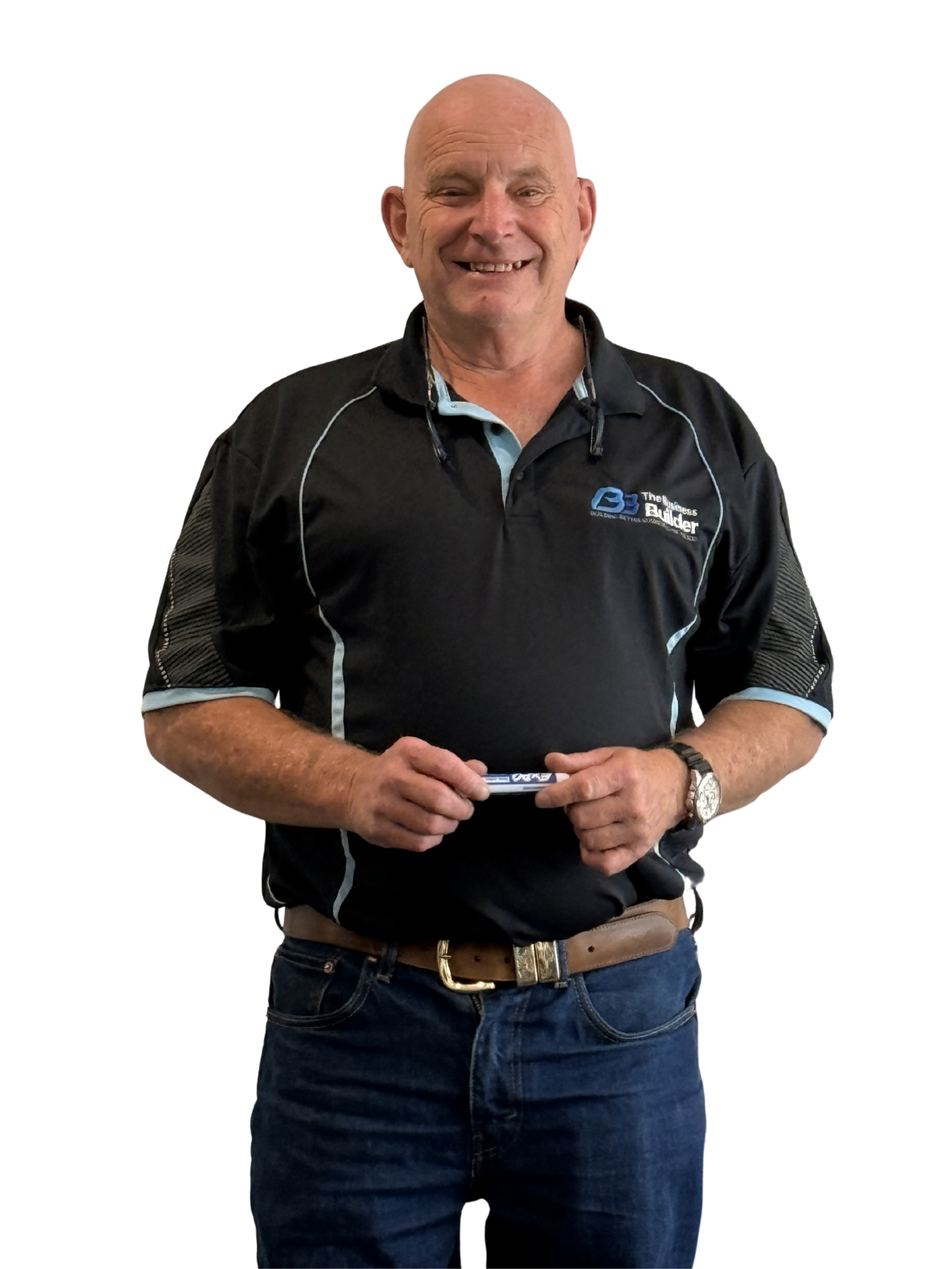 Ian Wholohan, a smiling middle-aged man with a bald head and a mustache, wearing a black polo shirt with a logo on the chest and white piping, standing and holding a marker, against a plain background.