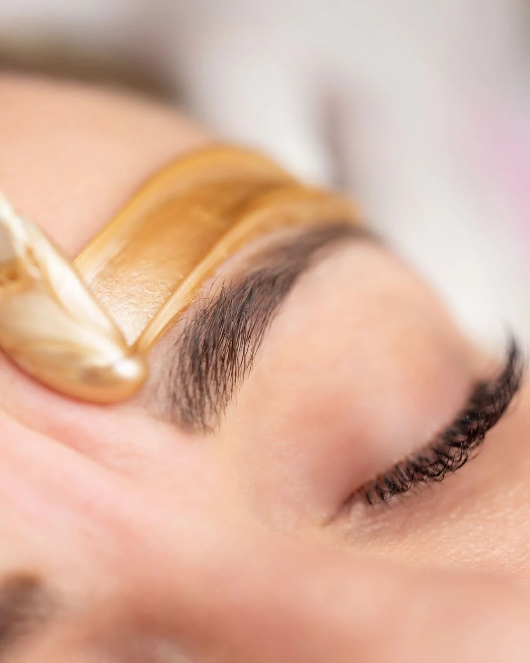 Facial waxing service designed to remove unwanted hair and create clean, polished results.