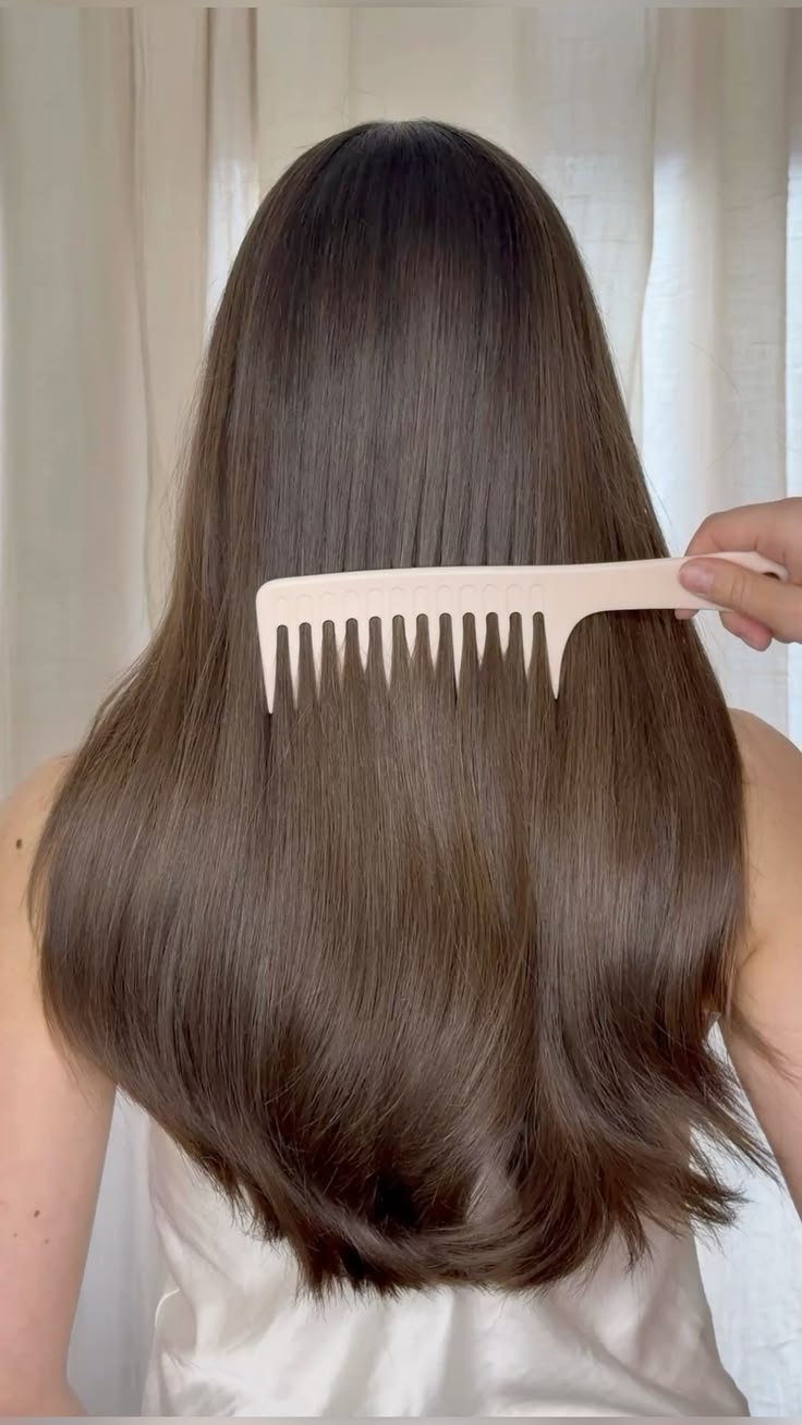 Healthy, shiny brunette hair after professional salon services.