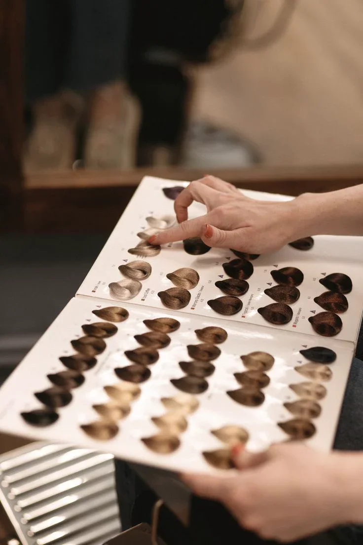 Hair color consultation using professional shade swatches.