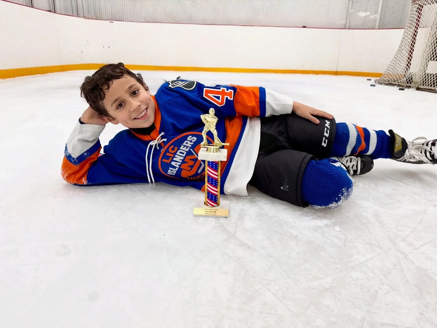 Leo strikes a pose with his new trophy #lic_ice #youthhockey #hockey4kids #hockey #lic