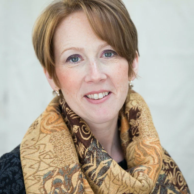 Headshot of a white woman with short hair