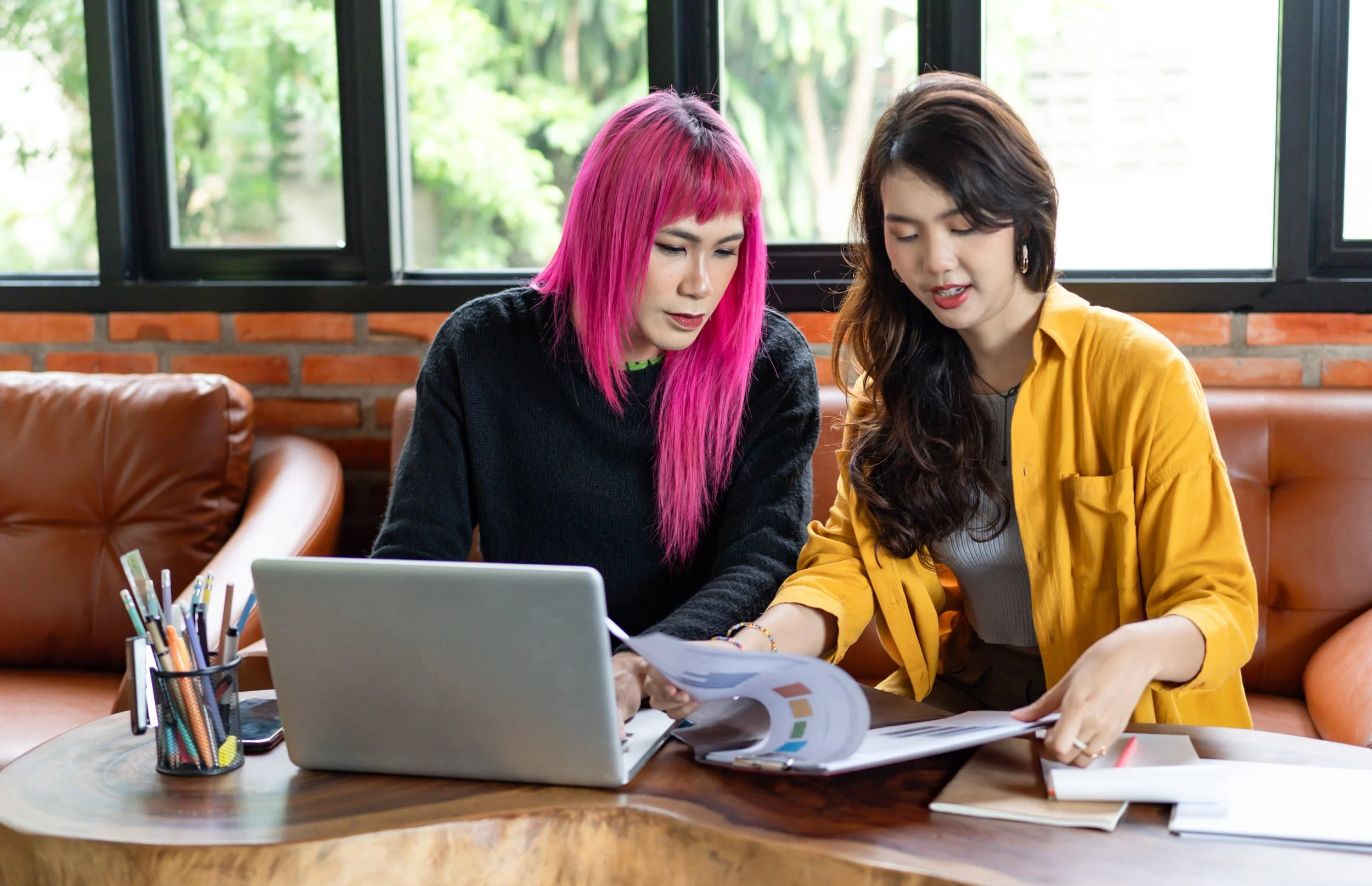 Photo of a transgender and nonbinary person looking at data reports