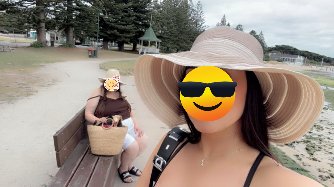 A woman taking a selfie at the beach with a large sun hat and sunglasses emoji covering her face, and a girl sitting on a bench with a face emoji covering her face, holding a straw bag.