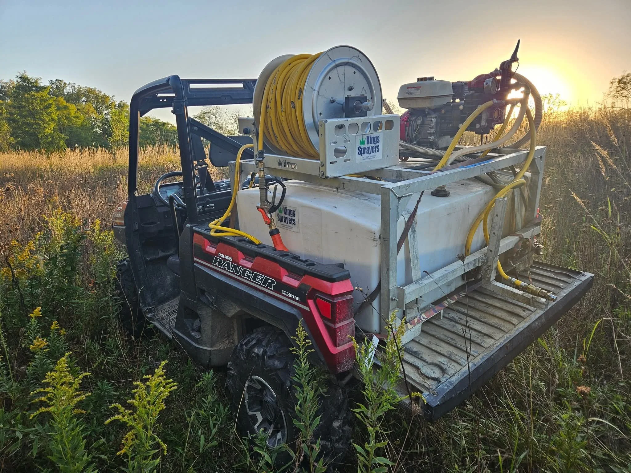 ATV with herbicide sprayer