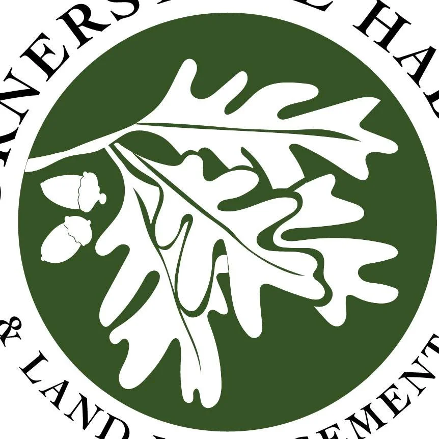 A green circular logo with white silhouettes of oak leaves and acorns, with text around the top and bottom edges. Cornerstone Habitat Management Logo