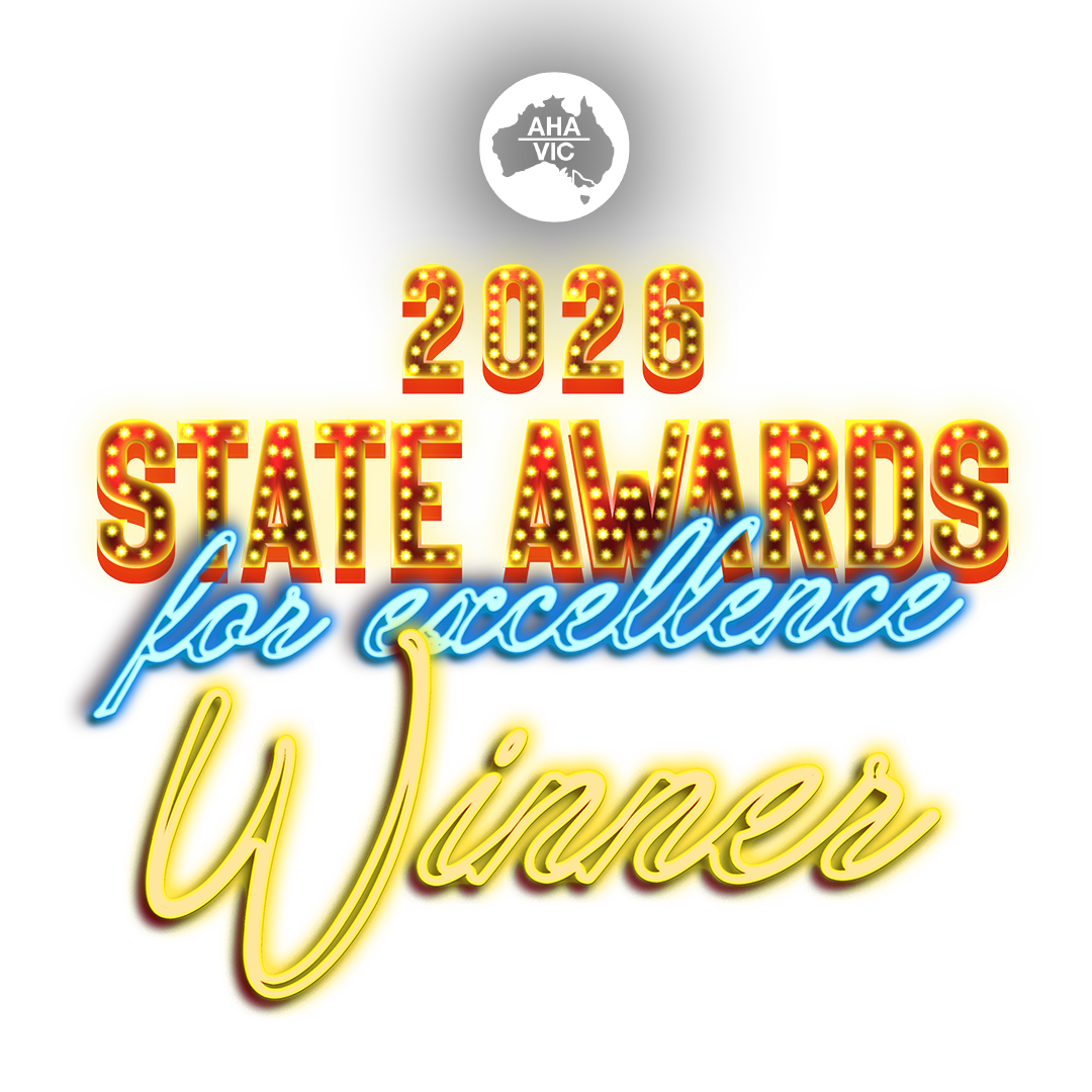 Bright neon sign reads '2026 State Awards for excellence Winner' with a black background and a small logo of Australia with 'AHA VIC' at the top.