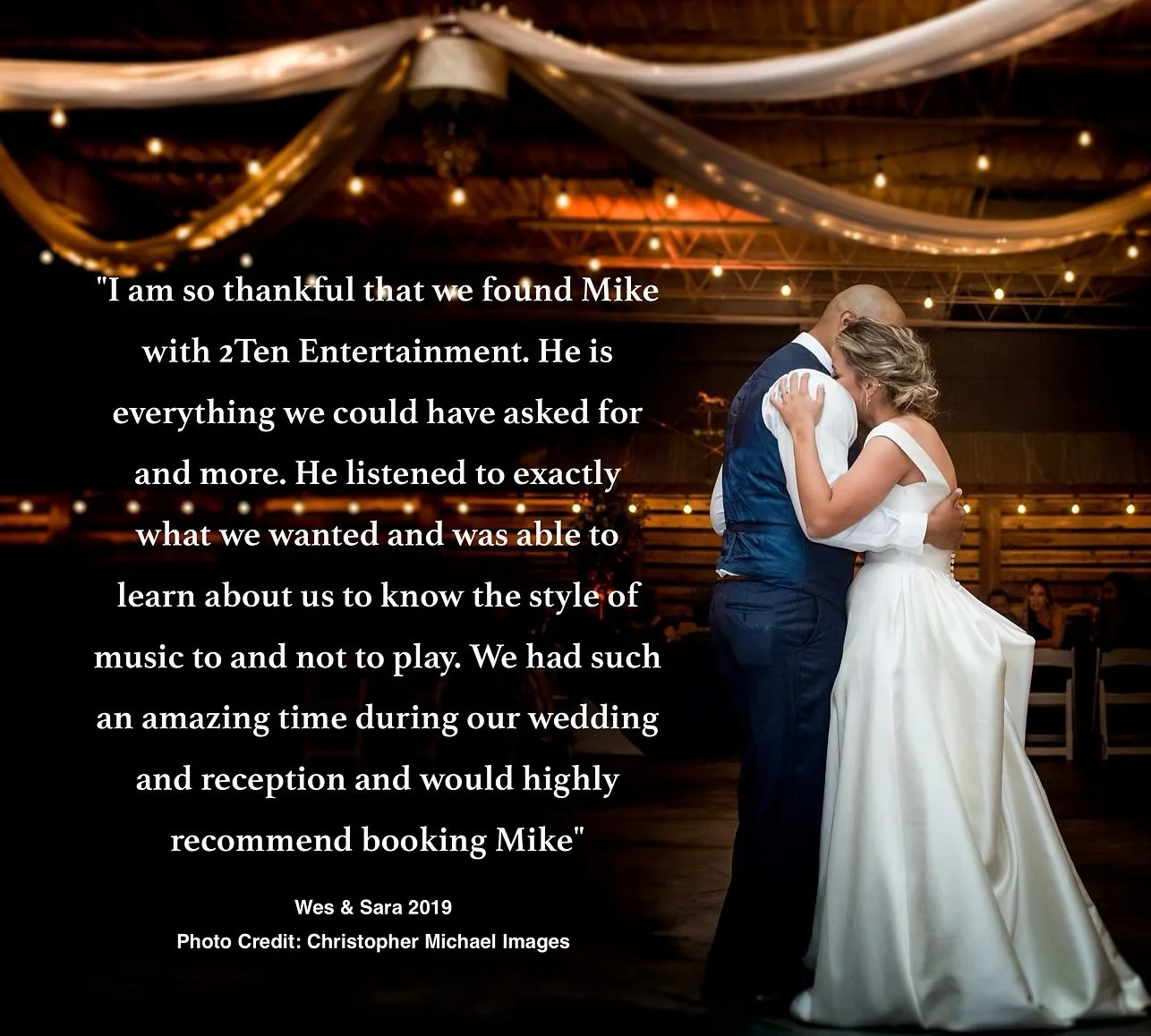 A wedding reception where a bride and groom are dancing closely, with wedding decorations and guests visible in the background.