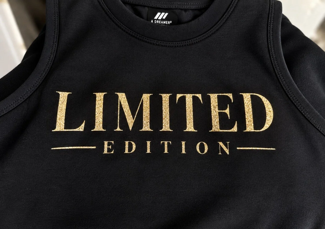Black shirt with the words 'Limited Edition' printed in gold text.
