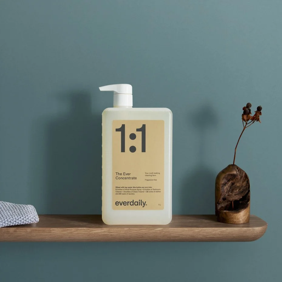 Everdaily product packaging design shown on a bottle in a styled bathroom setting.