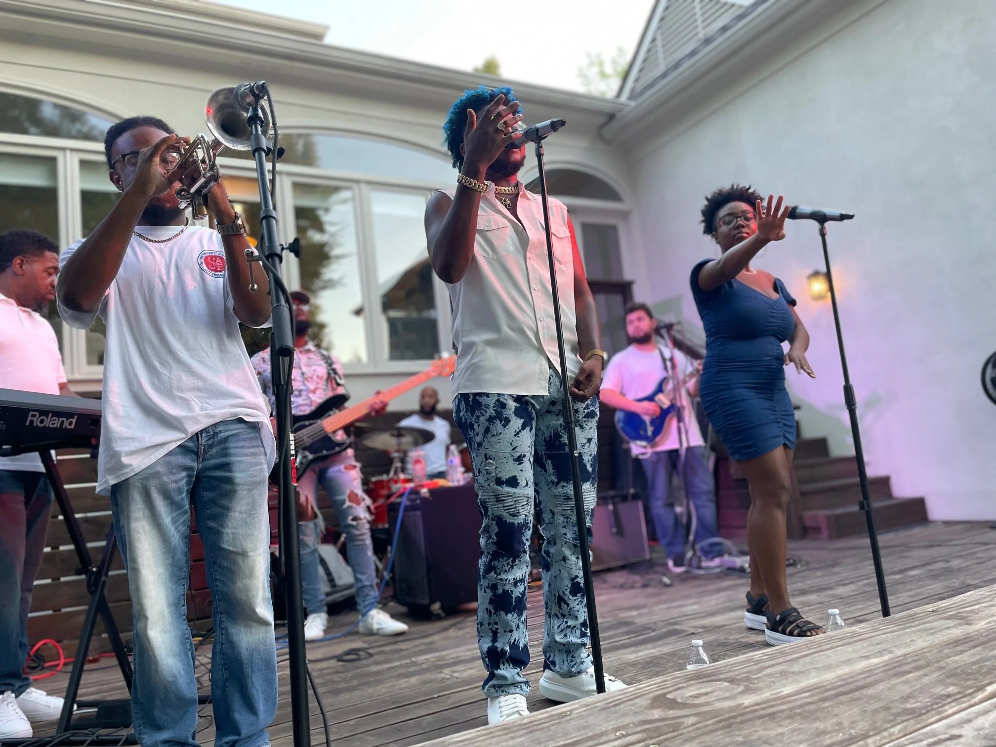 High-energy live band performance featuring horns, vocals, and rhythm section