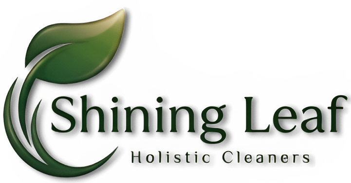 A logo for Shining Leaf Holistic Cleaners featuring a green leaf and text.