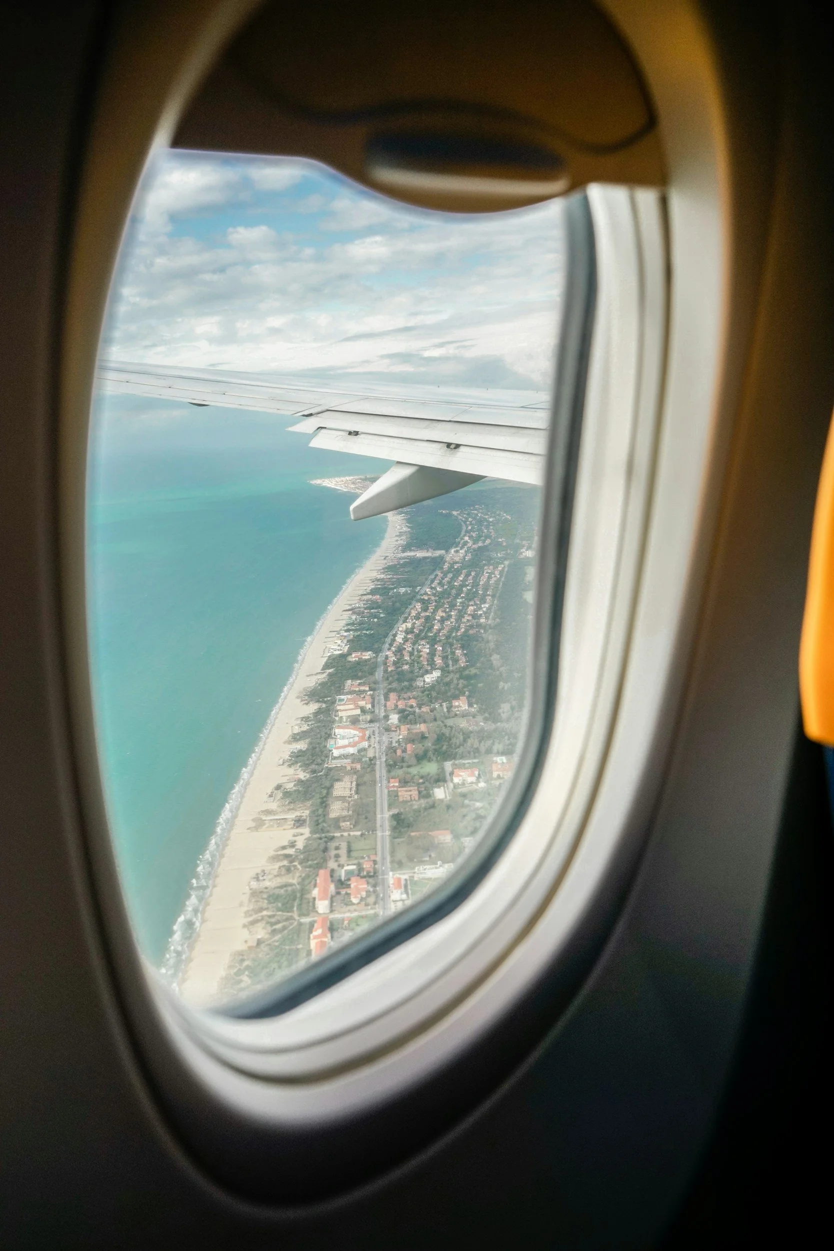 View of tropical beach from airplane window