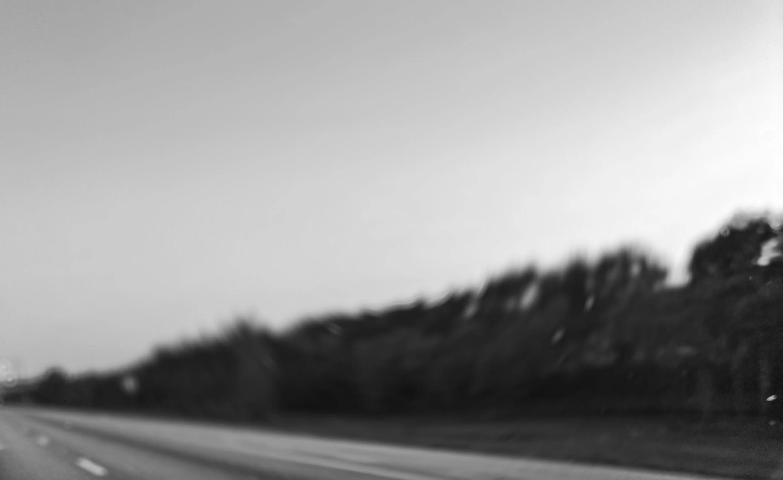 IN MOTION, UNSEEN

The landscape dissolves before it can be held.
Edges soften, forms slip past recognition, what remains is motion, continuous and unresolved.

There is no fixed point to arrive at, no stillness
to anchor the eye.
Only the quiet pers