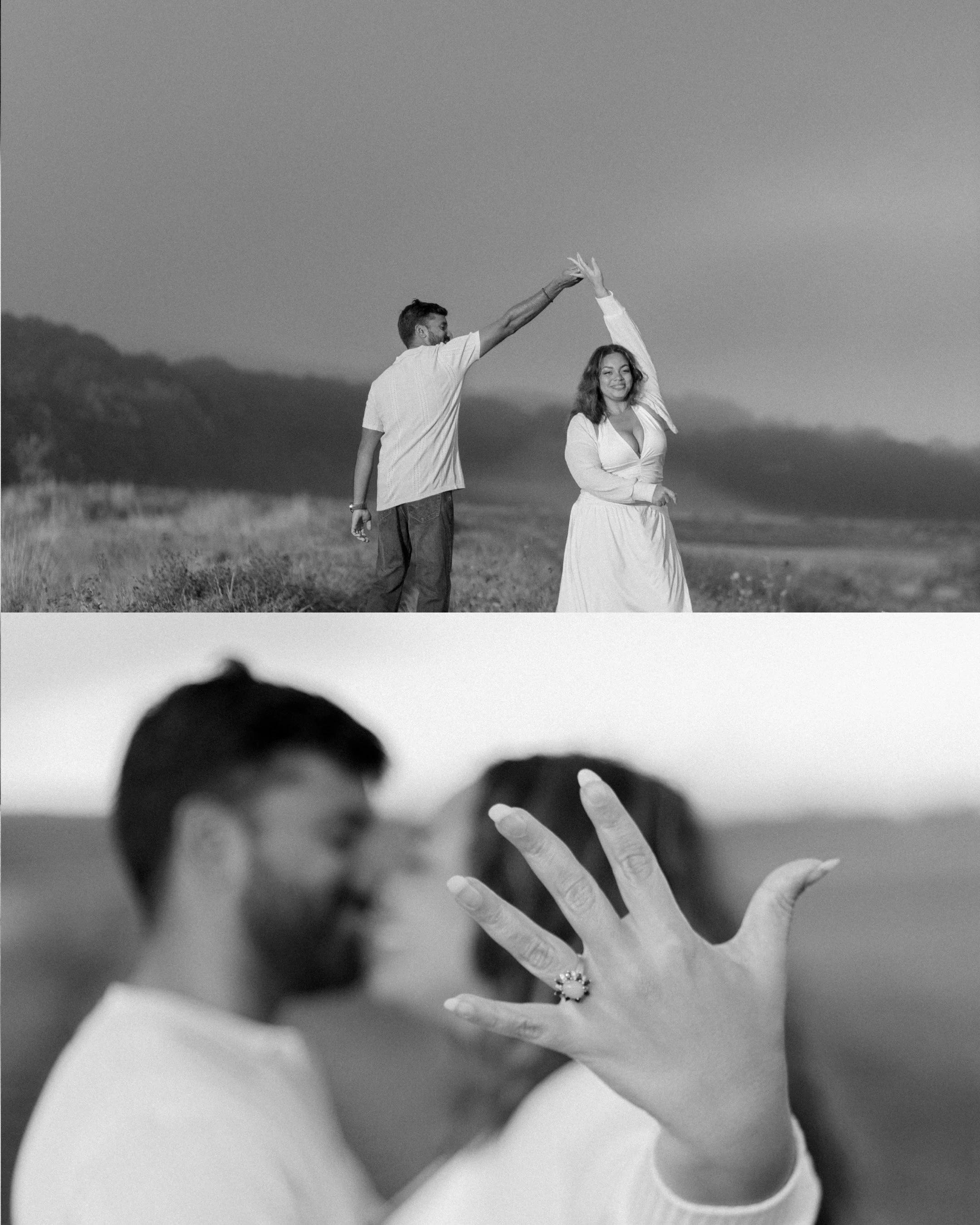 A couple stands outdoors in a field, with the man holding the woman's hand up and a smile on her face, both in a black and white photograph.
