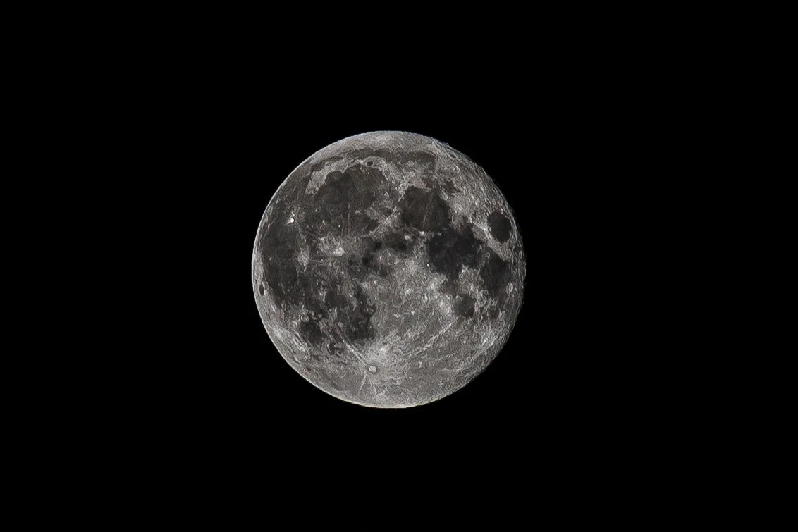 Full moon in a dark night sky.