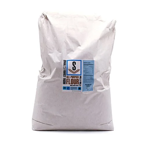 A white paper bag of all-purpose flour with a blue and black label.
