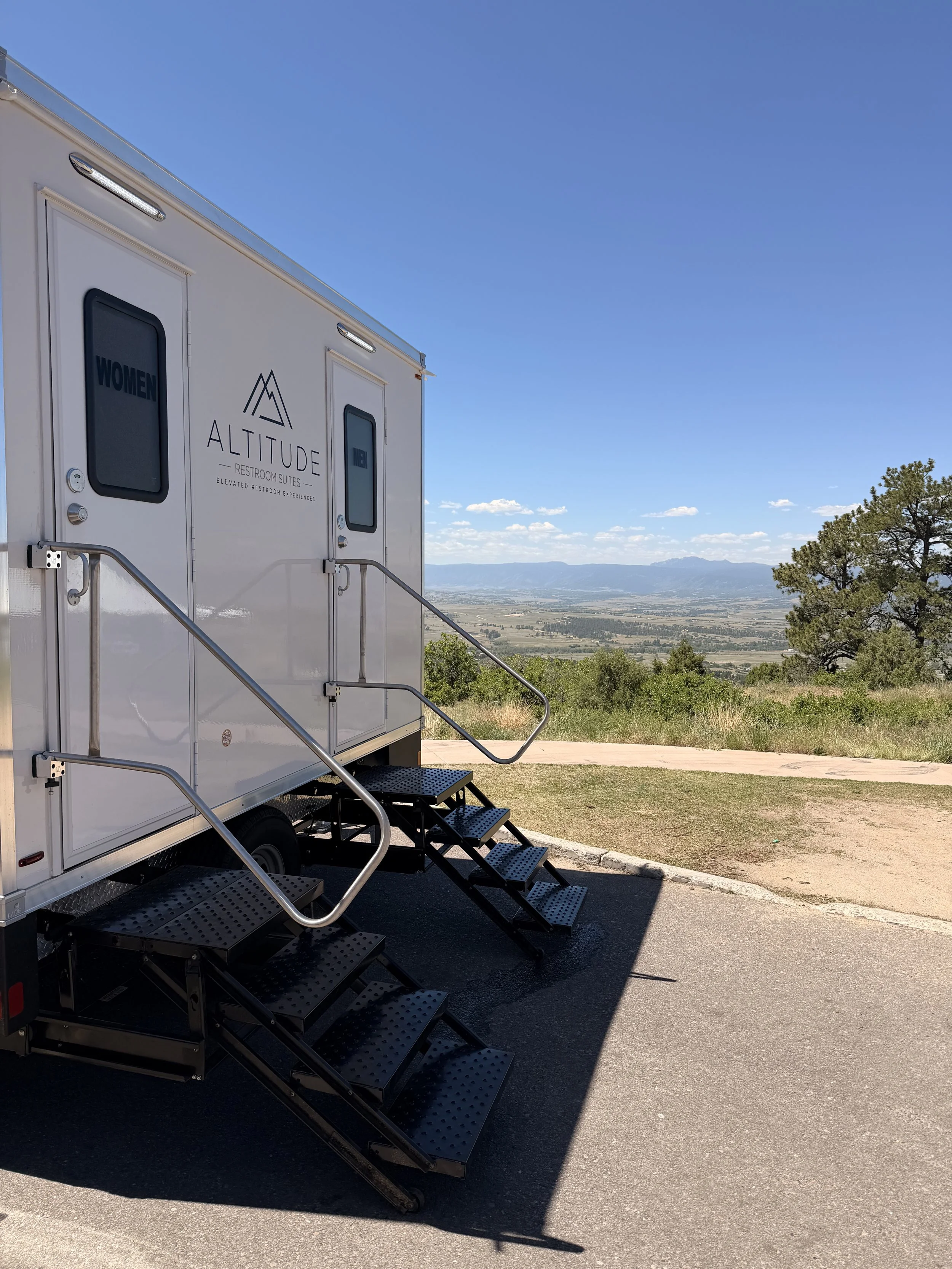 Luxury restroom trailer overlooking the Colorado mountains at a private wedding venue